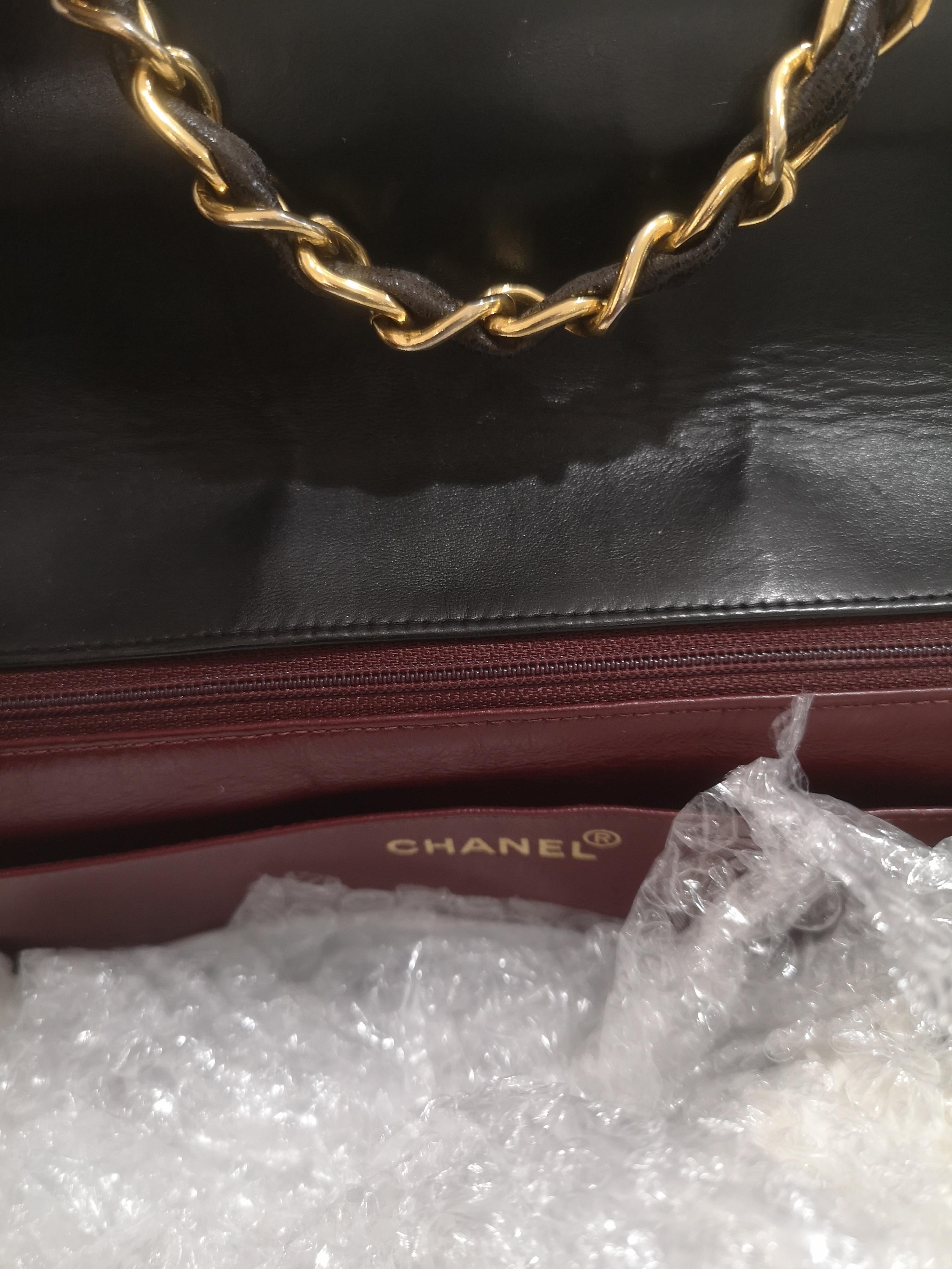 Women's or Men's Chanel black leather gold hardware CC logo shoulder bag