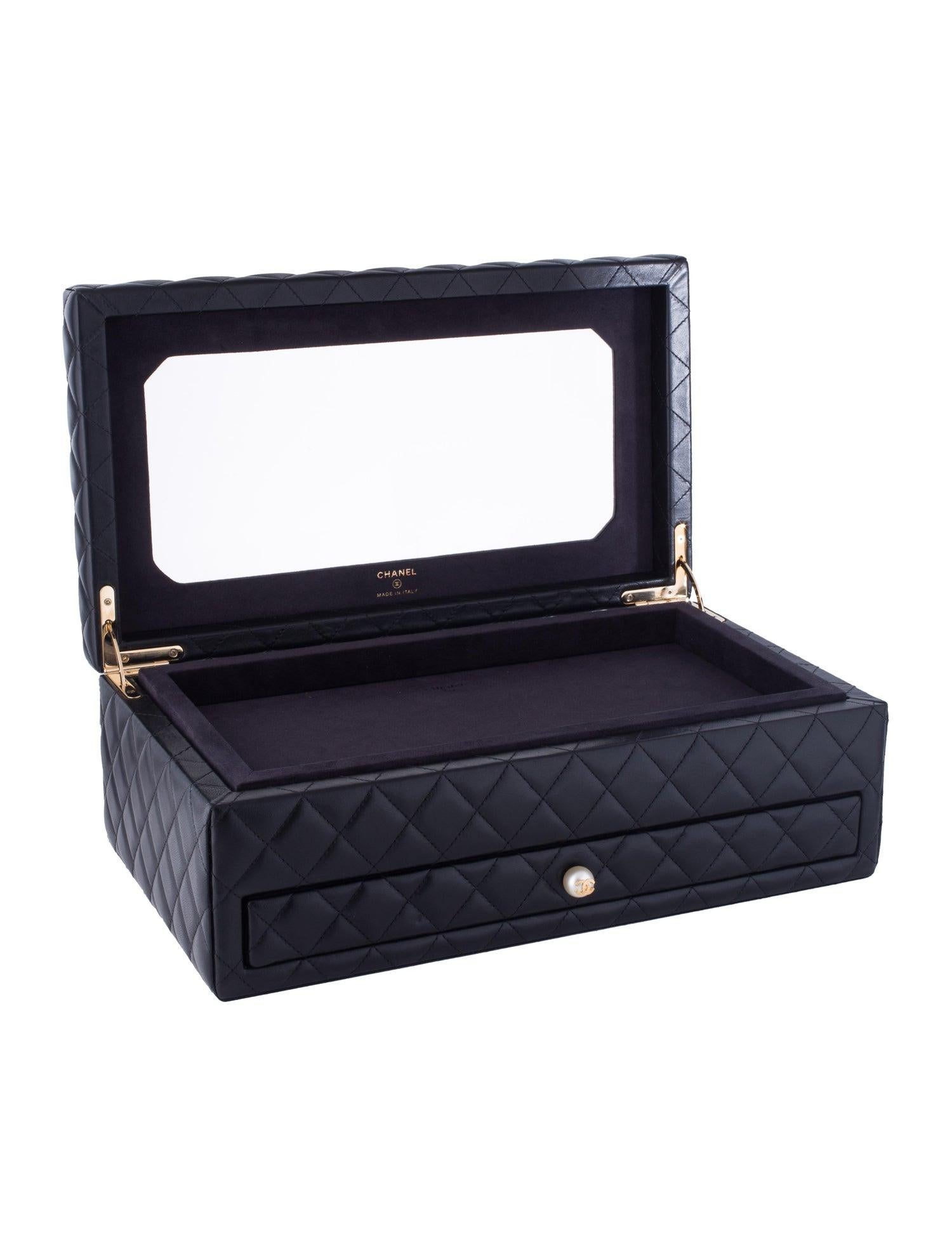 Chanel Black Leather Gold Pearl Women's Jewelry Drawer Vanity Storage Case Box

Lambskin leather
Faux pearl
Gold tone hardware
Features removable top tray and sliding drawer with 12 compartments 
Made in Italy
Measures 13.25