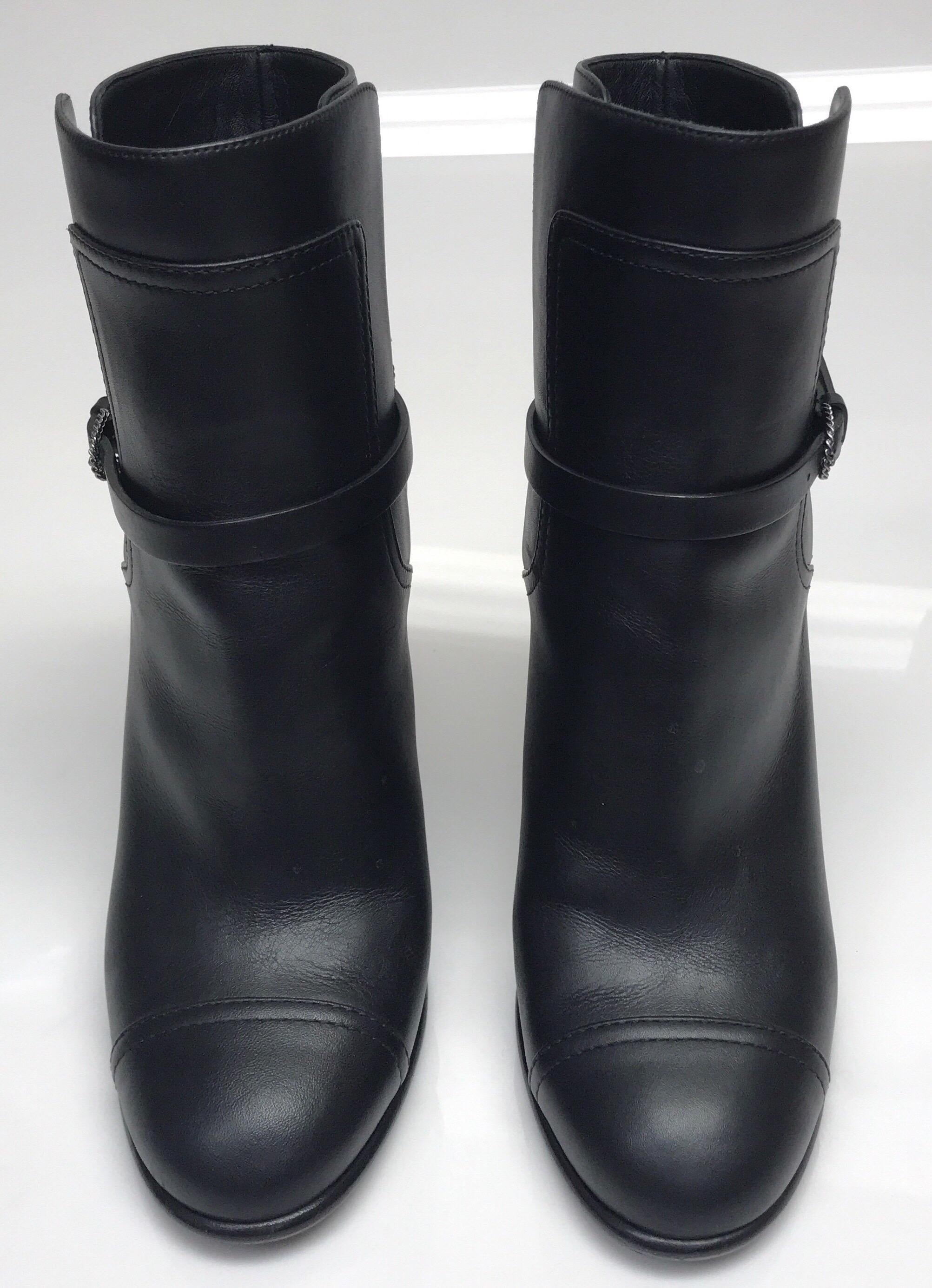CHANEL Black Leather High Heel Ankle Boots -38. The stunning Chanel boots are in excellent condition. they show barely any sign of use. It is made of black soft leather throughout and has a thin black leather strap around the base of the ankle.