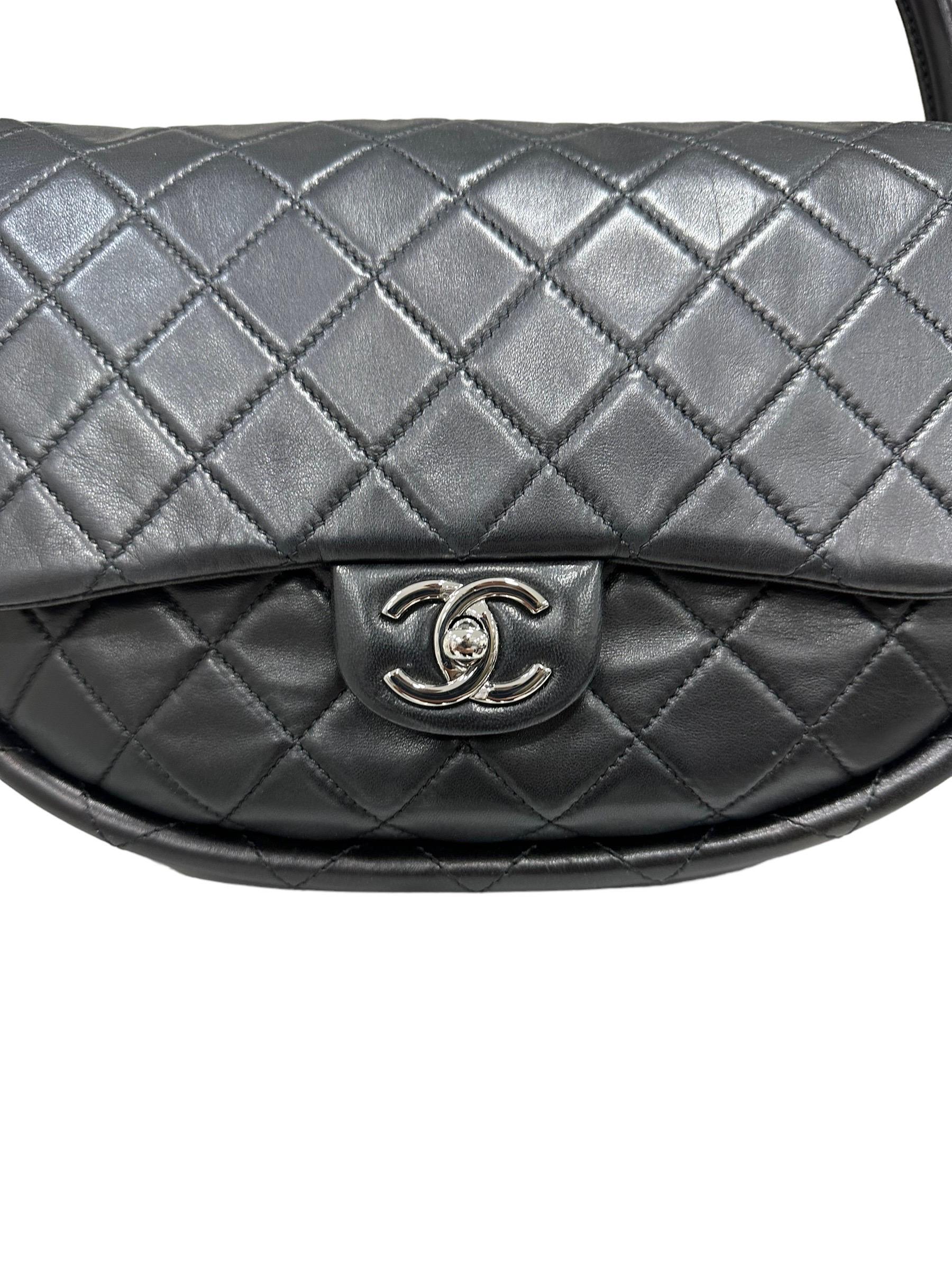 From the 2013 Spring collection there was this rare bag. Black quilted leather Chanel mini Hula Hoop bag with single interior zip pocket, structured top handles and front flap and CC turn-lock closure . Excellent condition for this unique and