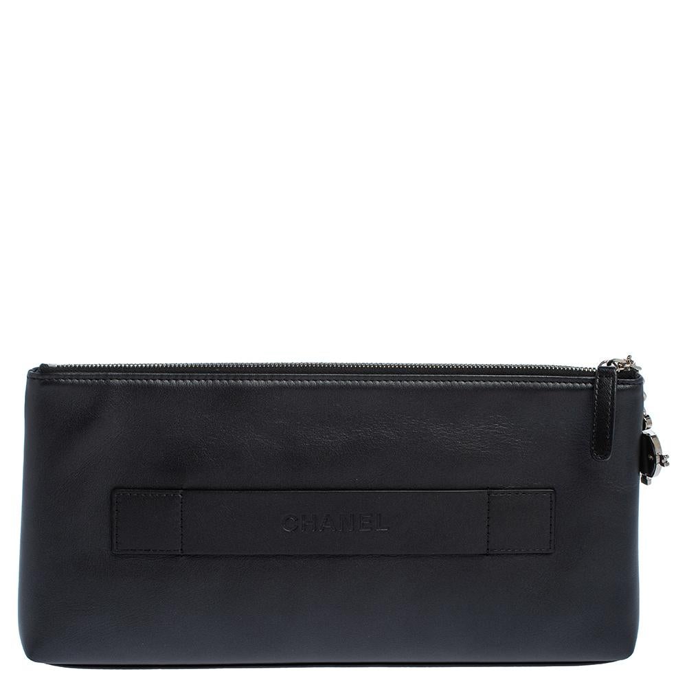 Chanel brings you this quirky yet elegant clutch. Crafted from leather and designed in a keyboard style, the front features the label's logo and detail for a signature finish. The zip fastening opens to a well-sized interior for your