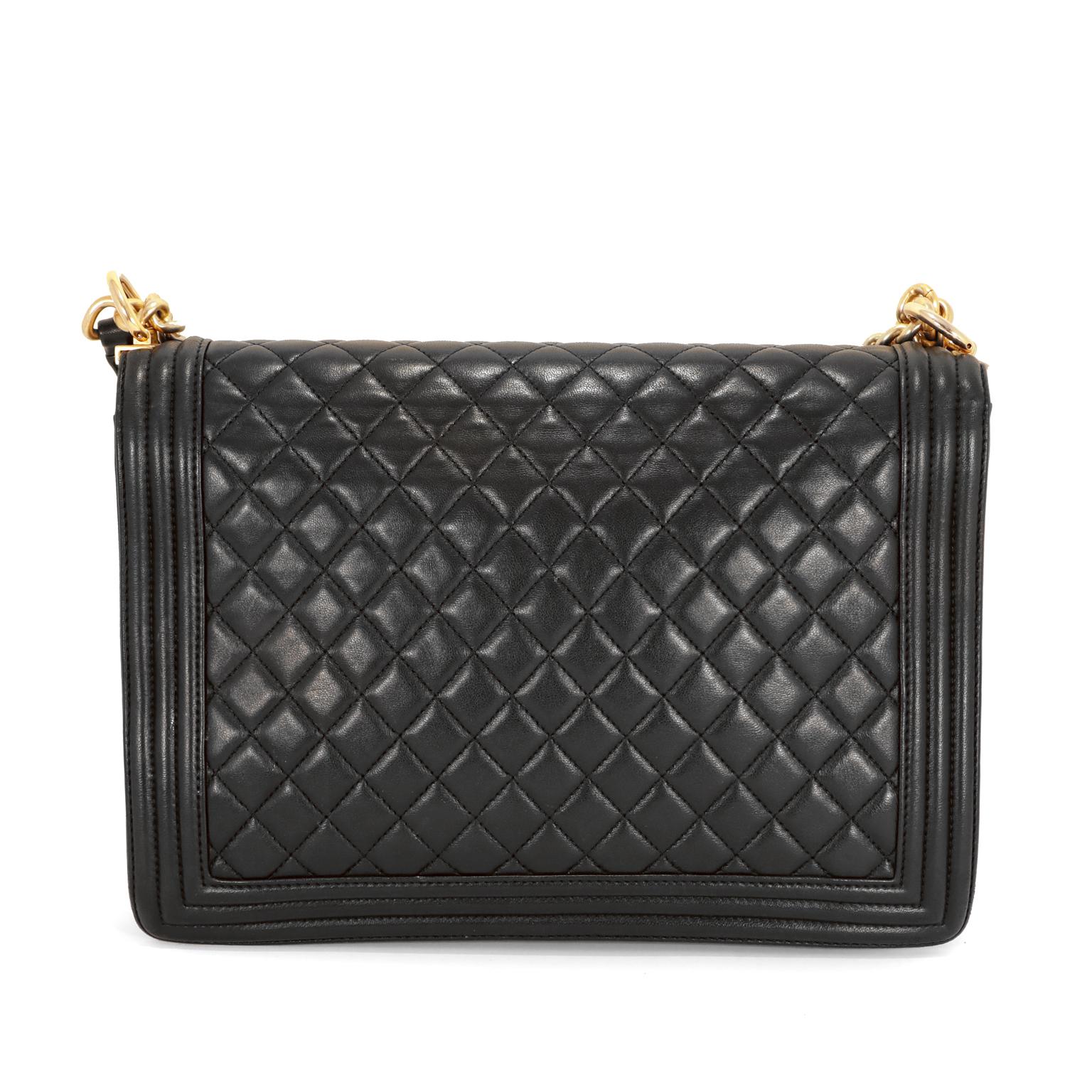 This authentic Chanel Black Leather Large Boy Bag is in excellent condition.     The updated design is structured and edgy with a versatility that makes it extremely popular.  
Black leather is quilted in signature Chanel diamond stitched pattern. 