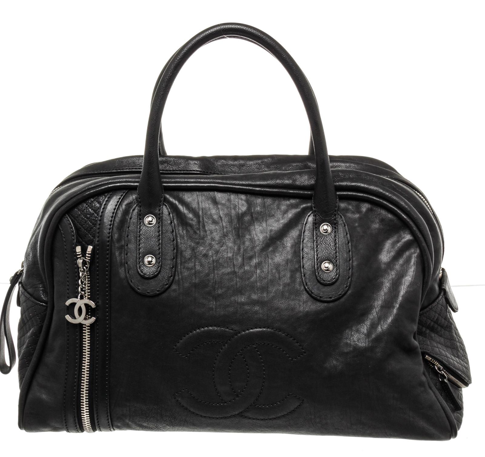 Chanel Black Leather Large CC Boston Bag with leather, gold-tone hardware, trim leather, interiorÂ slipÂ pocket,Â dual top handle and zipper closure.

47200MSC