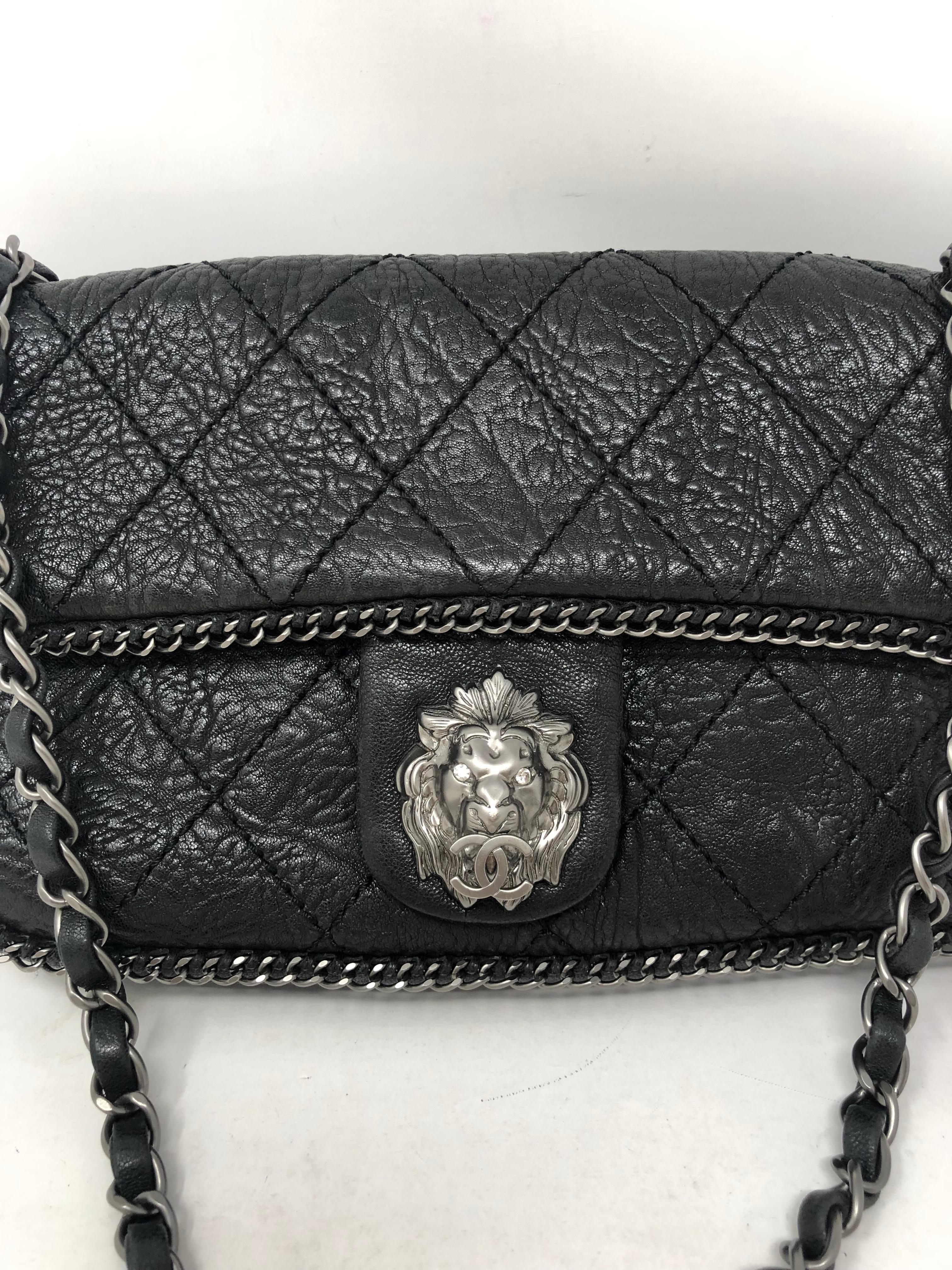 Chanel Black Leather Lion Bag. Lion medallion in center. Silver antique hardware. Limited and unique bag with all the details. Chain around trim. Medium size. Mint condition. Guaranteed authentic. 