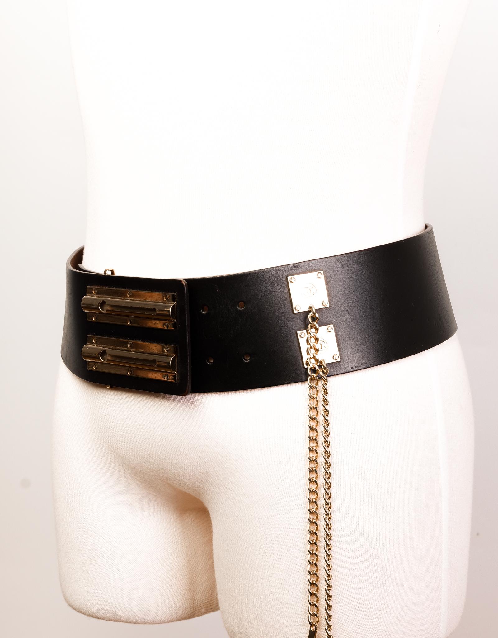 This Chanel Maxi belt is made with black leather and features a double sliding lock closure with gold-tone hardware.

COLOR: Black
MATERIAL: Leather
ITEM CODE: 02P
MEASURES: L 40” x W 3”
SIZE: 90/36
COMES WITH: Dust bag
CONDITION: Very good - belt