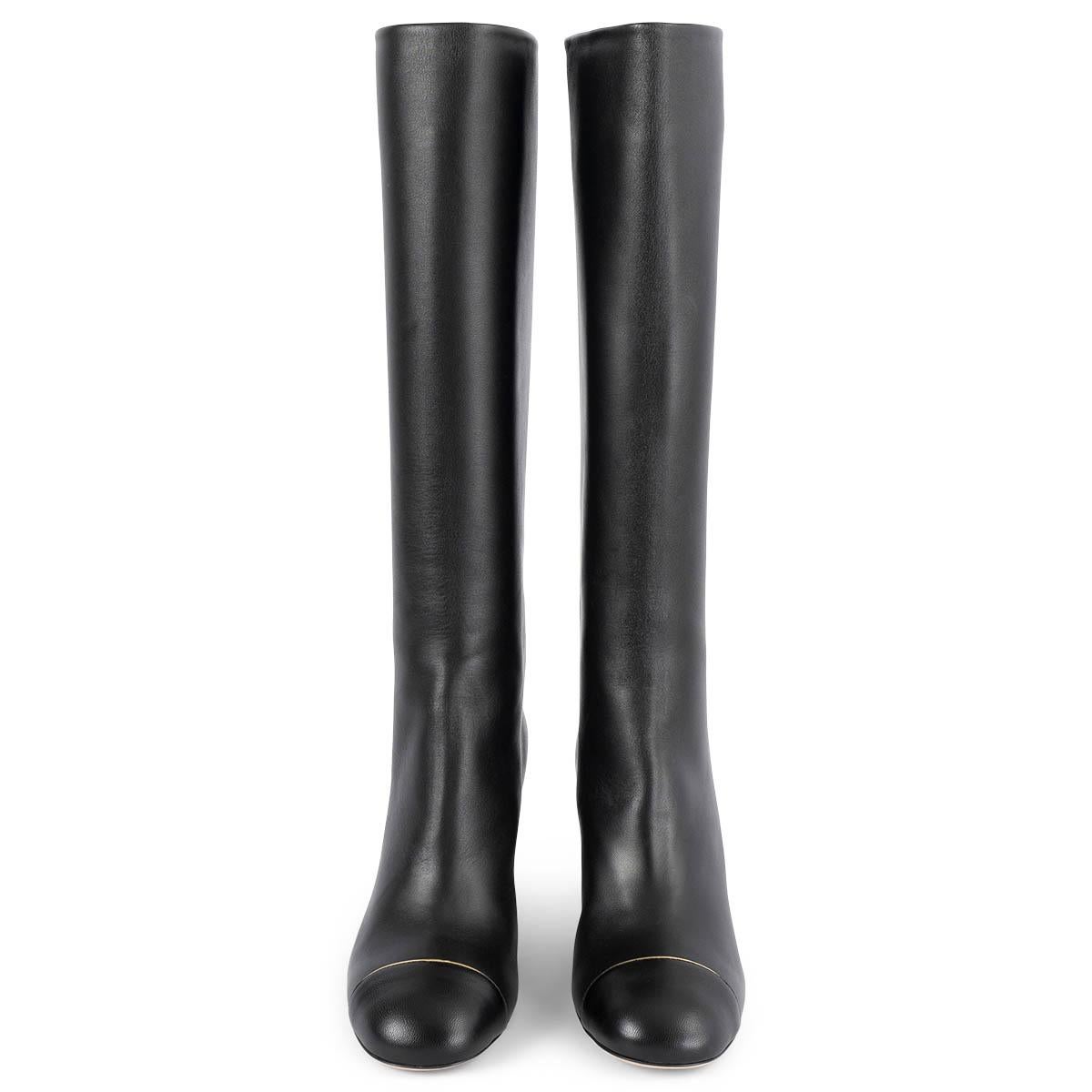 100% authentic Chanel knee-high block-heel boots in smooth black calfskin with gold-tone metal trim on the heel and classic cap toe. Brand new. 

Measurements
Model	G28660
Imprinted Size	38
Shoe Size	38
Inside Sole	25cm (9.8in)
Width	7.5cm