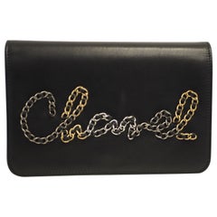 Chanel Black leather multitone hardware lettering WOC handle or shoulder bag