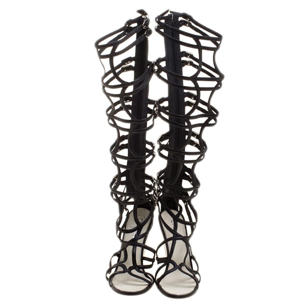 Catch everyone's glances with these gladiator sandals from Chanel's Cruise 2010 Collection. They've been crafted from leather and styled in a strappy layout with small buckles, full back zippers, and wedges. They'll look great with all your chic