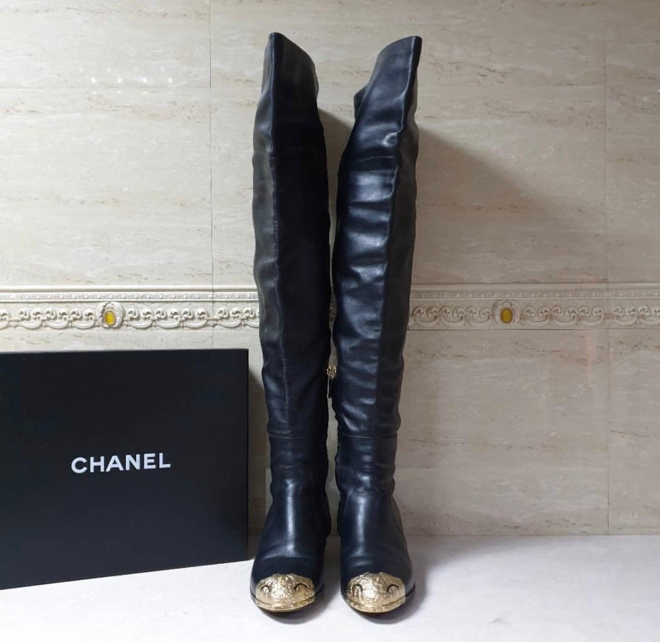To complement your unparalleled style, Chanel brings you these gorgeous thigh high boots that come flowing with high-fashion. It is crafted from black leather and designed with CC metal cap toes and stars decorated on the short heels. Pair them with