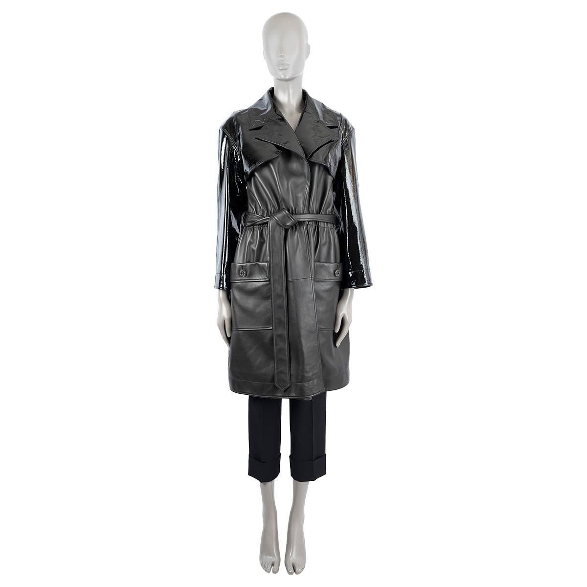 100% authentic Chanel trench coat in black leather with patent leather top. Features two patch pockets with additional flap pocket on the front and features an elastic waistband. Closes with a belt. Has been worn once or twice and is in virtually