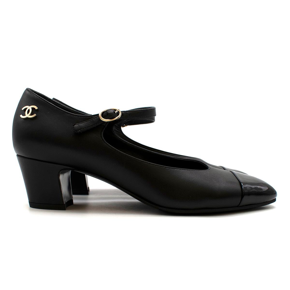 Chanel Black Leather and Patent Pumps 

- Classic Chanel black leather pump with patent toe
- Block heel for comfort and style
- Gold CC logo detailing
- Delicate ankle strap with small gold buckle

Made in Italy

PLEASE NOTE, THESE ITEMS ARE