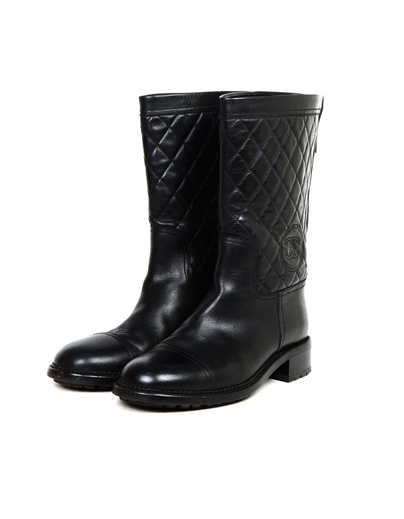 Chanel Black Leather Quilted CC Biker Boots Sz 40

Made In: Italy
Color: Black
Hardware: Black
Materials: Leather, metal
Closure/Opening:  Zipper back
Overall Condition: Very good pre-owned condition with exception of scratch at front toe of right