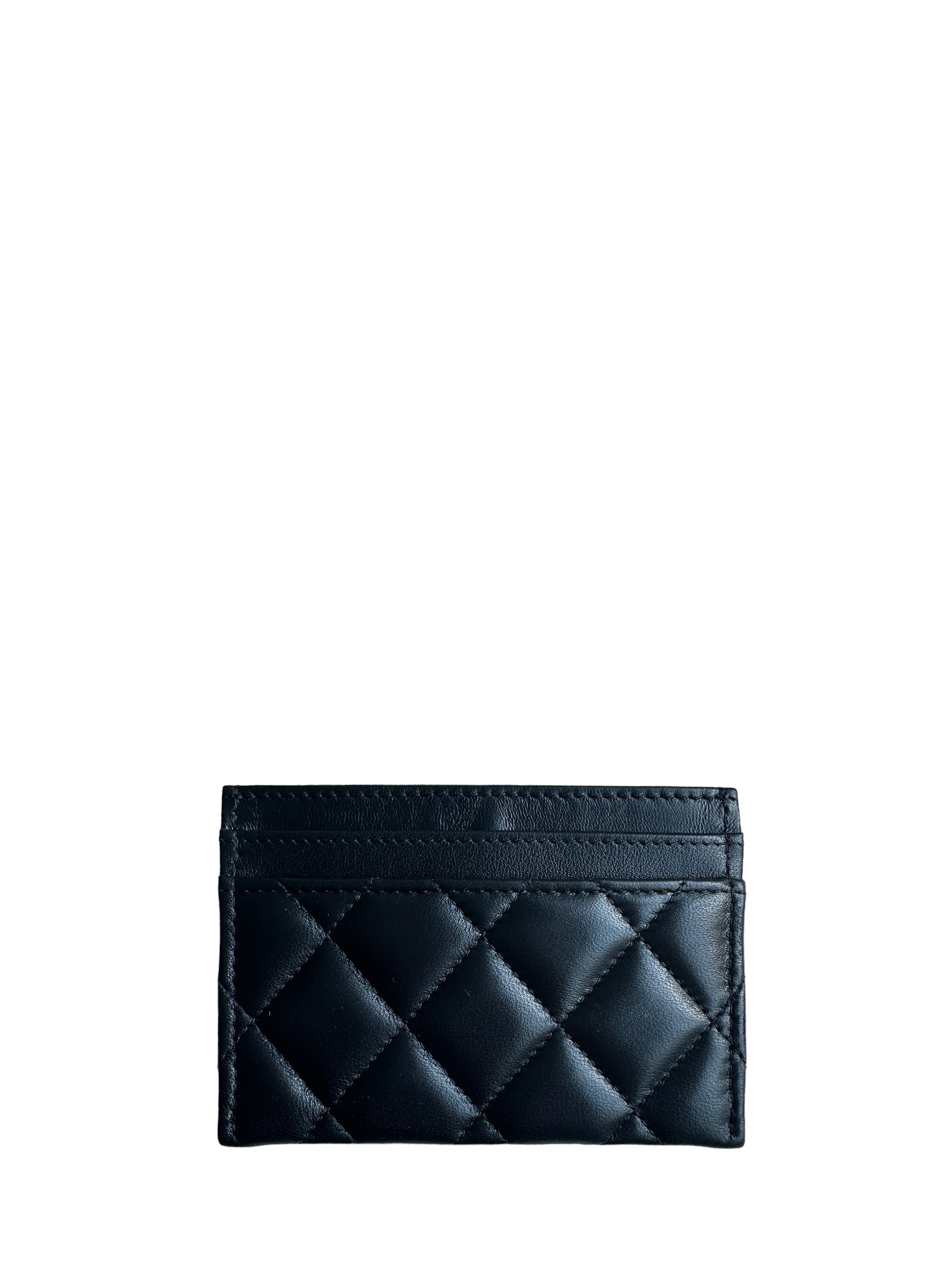 Chanel Black Leather Quilted CC Card Holder

Made In: Spain
Color: Black
Hardware: Goldtone
Materials: Lambskin leather
Lining: Leather and grosgrain
Four credit card slots
Exterior Condition: Like new
Interior Condition: Like new
Includes: Box and