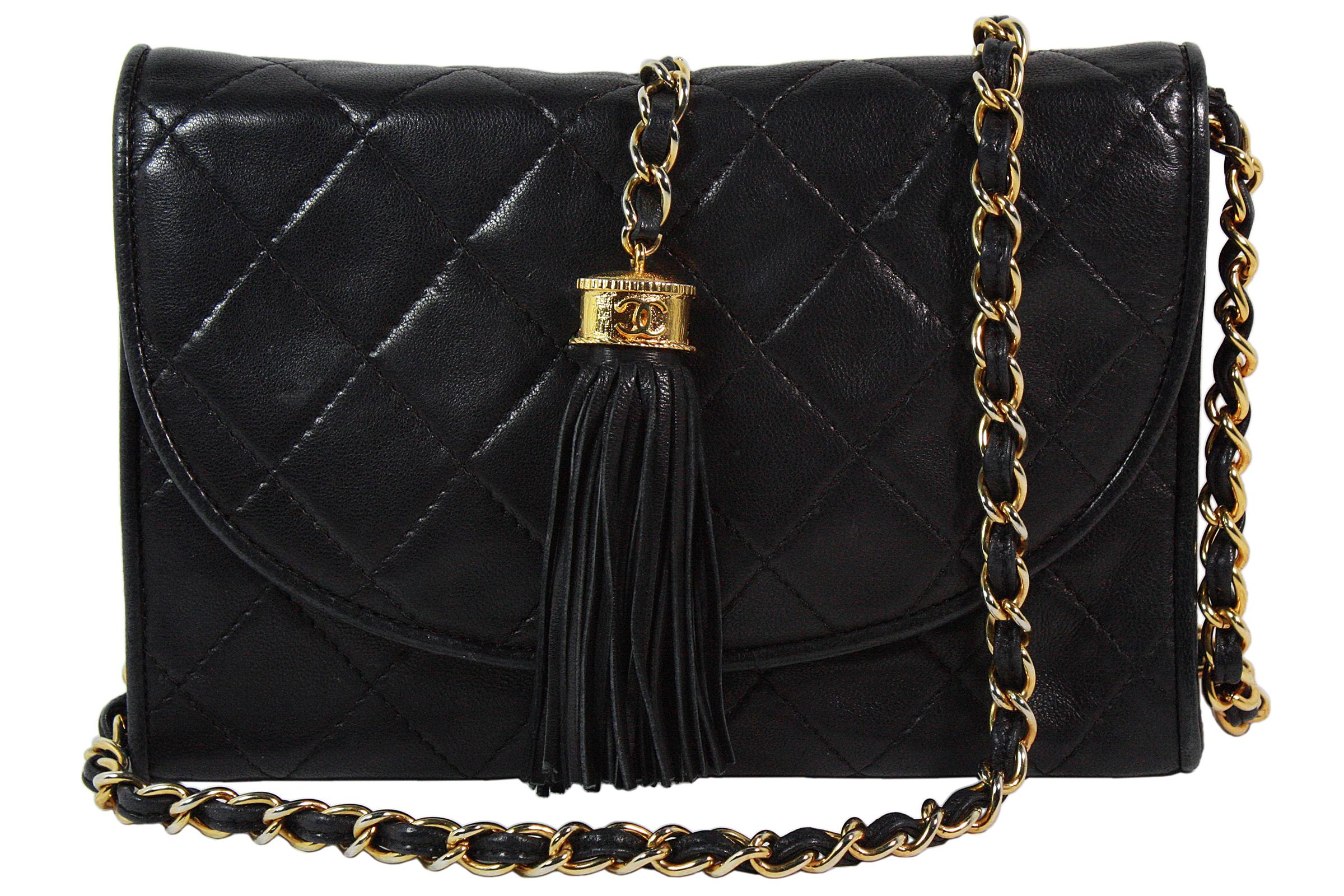 Chanel crossbody bag
Made in Italy
Soft black quilted leather 
Hanging tassel with gold chain and CC logo 
Gold and leather chain strap that can be stored inside to make bag a clutch
Strap length: 38 inches 
Black leather lining 
Interior zippered