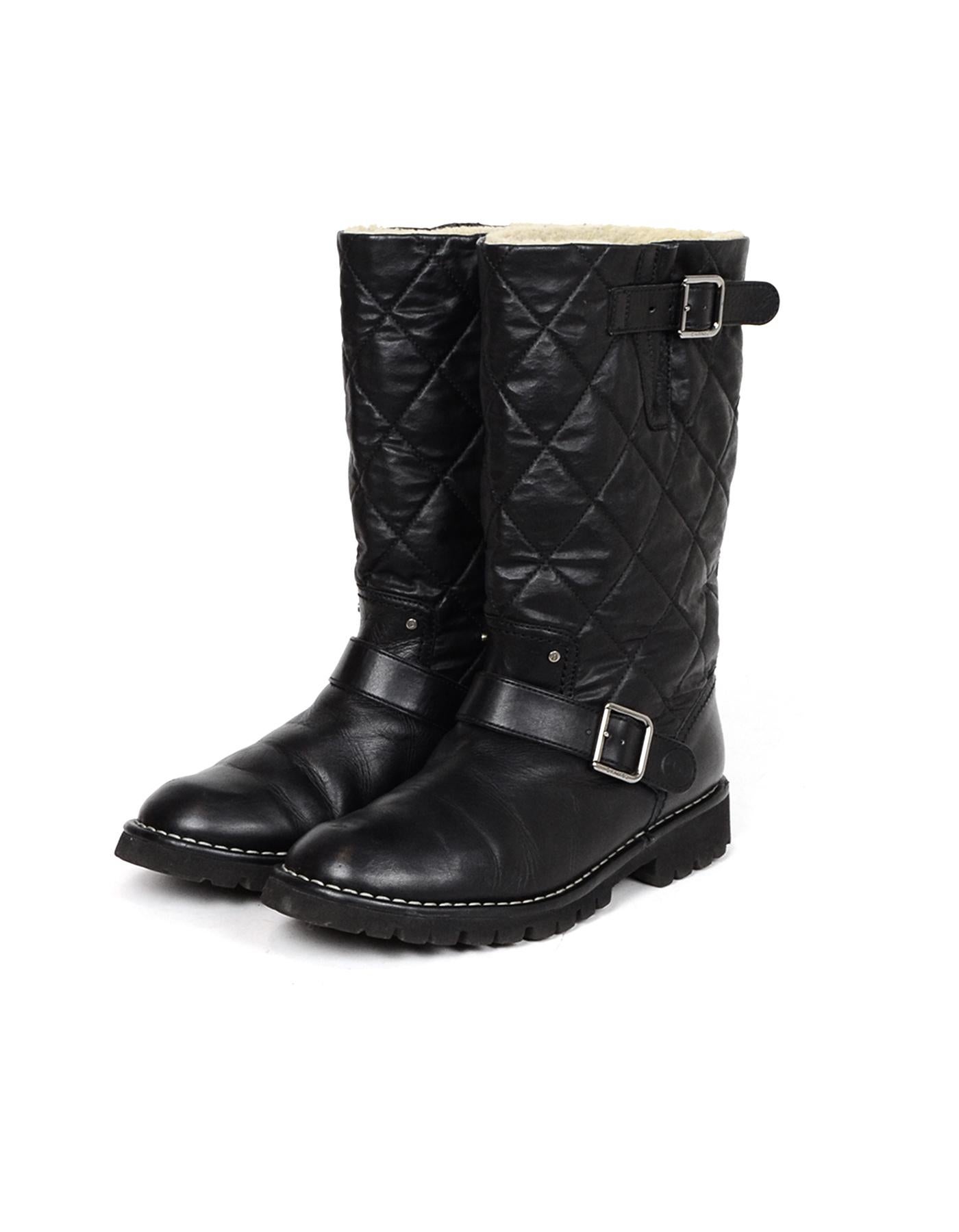 Chanel Black Leather Quilted Moto Boots with Shearling Lining sz 38.5

Made In: Italy
Color: Black
Hardware: Silvertone
Materials: Leather, shearling lining
Closure/Opening: Side buckle
Overall Condition: Excellent pre-owned condition, some small