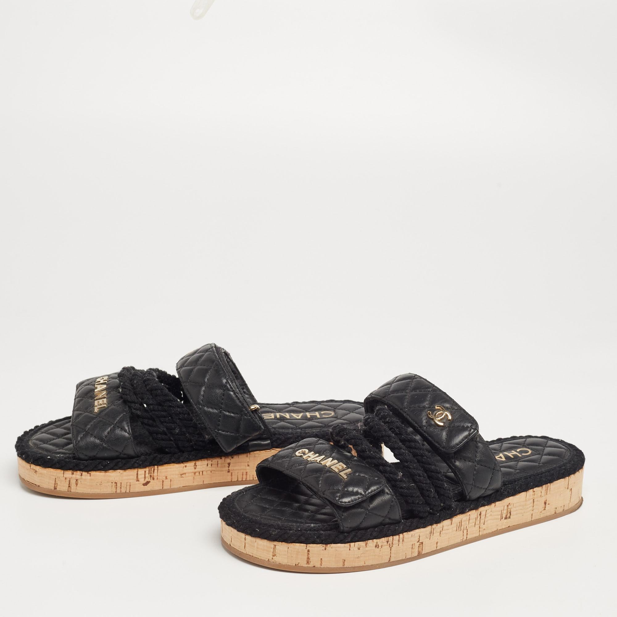 These sandals by Chanel showcase a lovely design. Crafted from leather, the black flats feature open toes and velcro straps. They come with comfortable leather-lined insoles and tough rubber soles. Wear them with shorts or jeans for an edgy appeal.