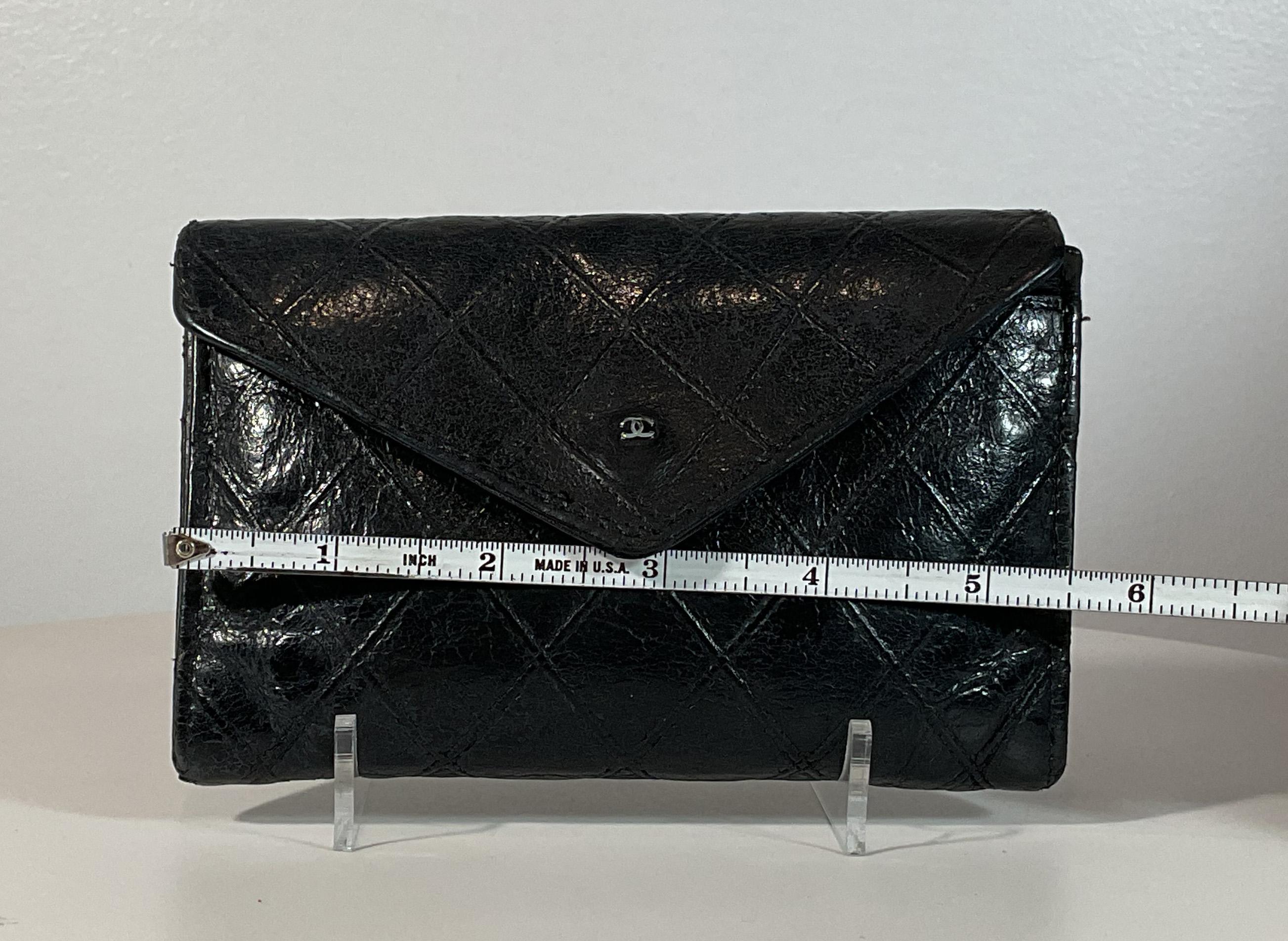 Chanel black quilted leather wallet. This wallet is in good condition. There are no significant flaws or wear areas to consider with this lovely wallet. 
It had been very gently used and carefully stored in its sleeper bag over the years.
The wallet