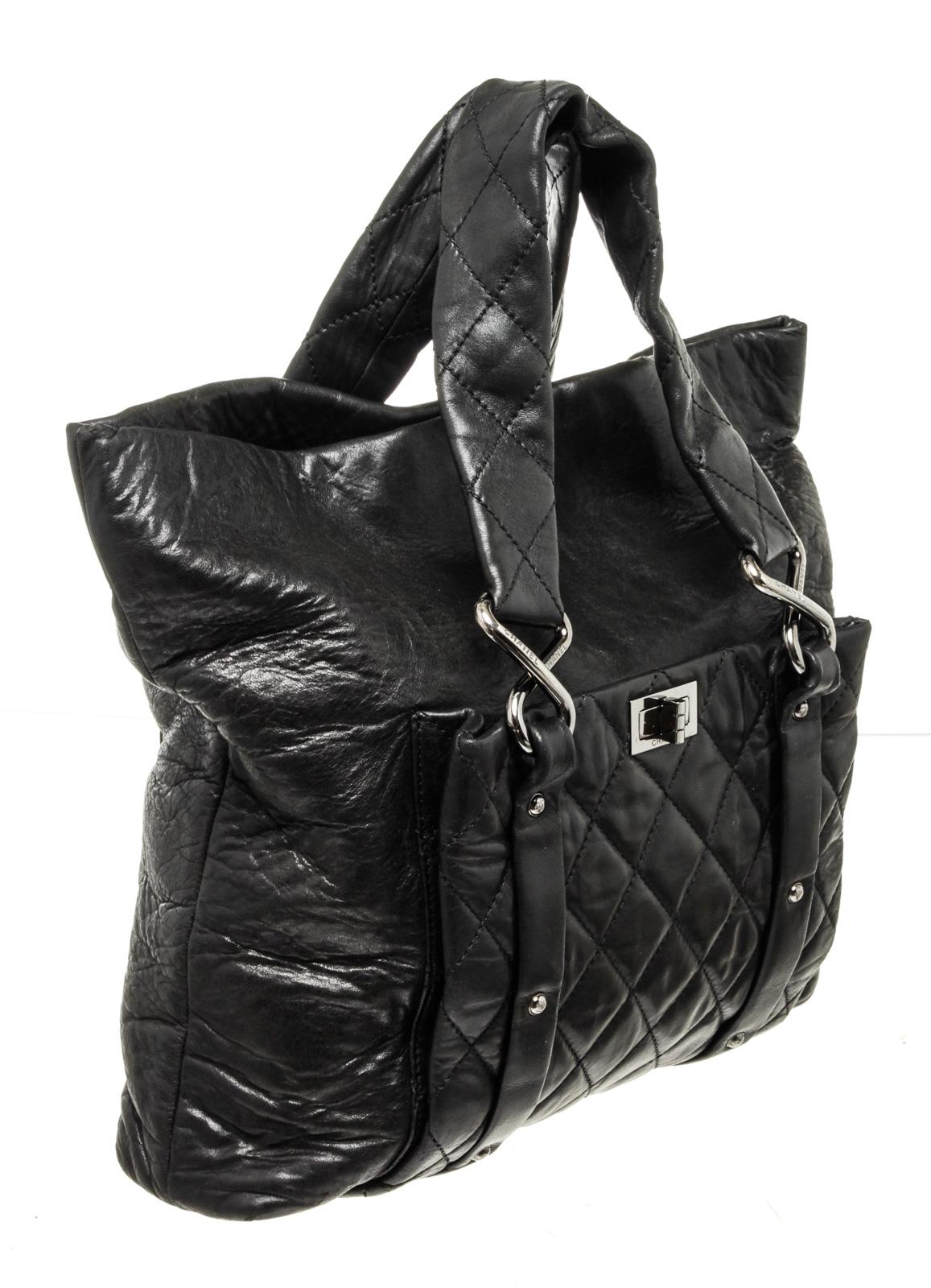 Chanel Black Leather Reissue Shoulder Bag with leather, gold-toneÂ hardware, interior slip pocket, dual top handleÂ andÂ flapÂ closure.

47244MSCÂ 