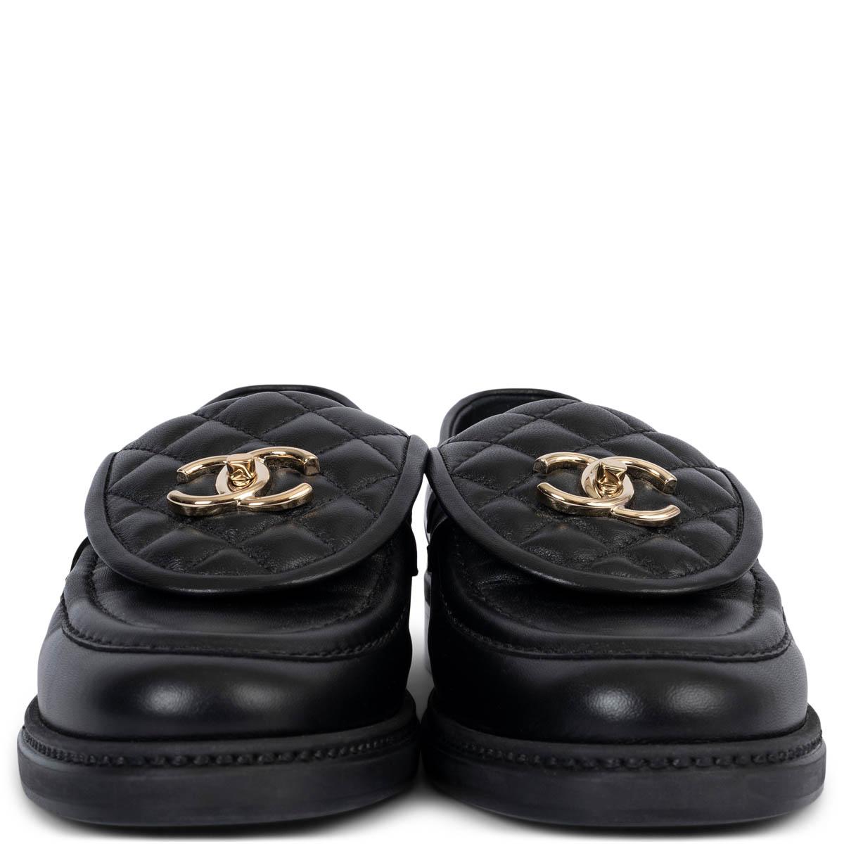 100% authentic Chanel REV turnlock loafers in black smooth leather with quilted flap and beige gold-tone metal CC  logo.  Have been worn once inside and are in virtually new condition. 

Measurements
Model	REV G36646 
Imprinted Size	39
Shoe