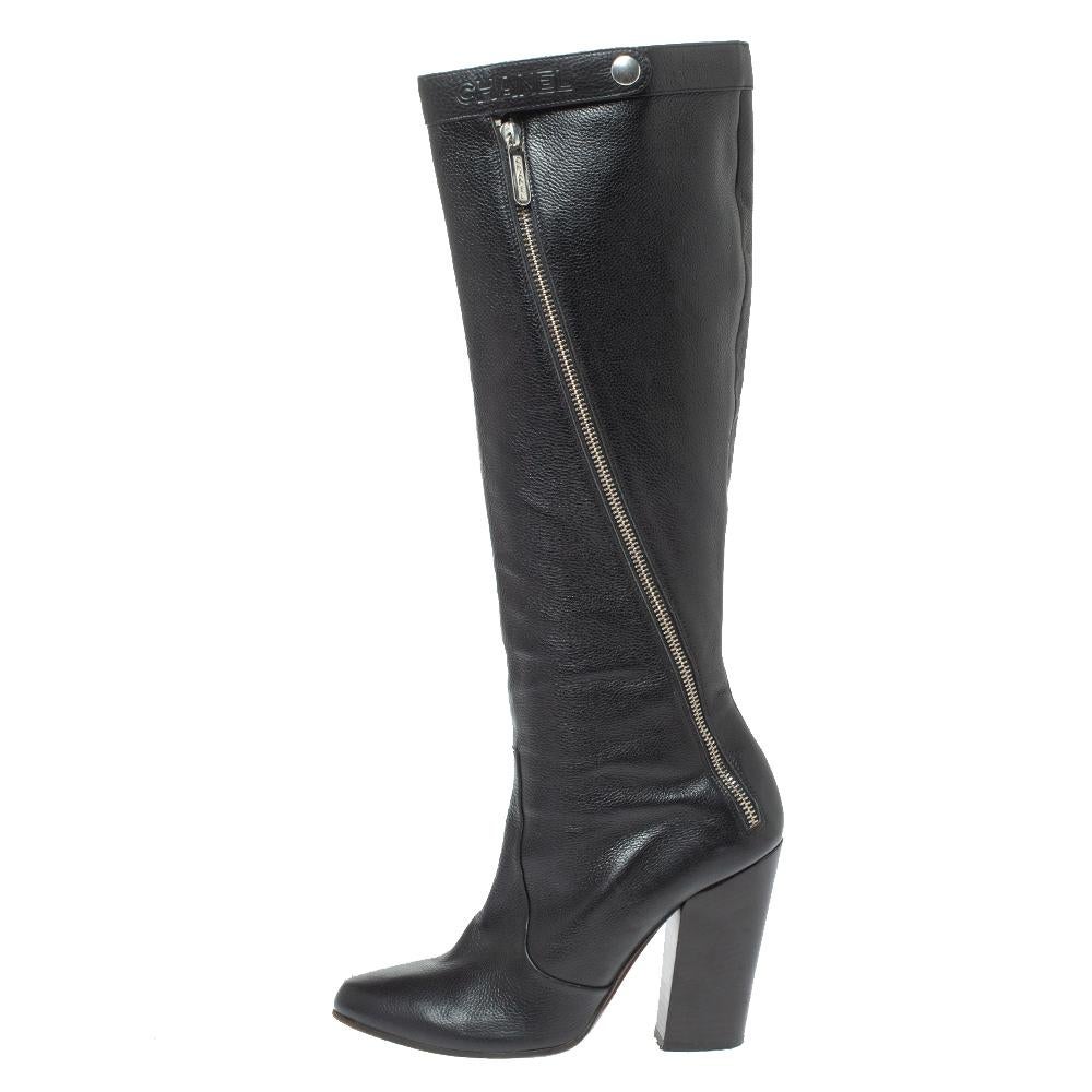 Defined by a modern appeal and impeccable craftsmanship, these knee-high boots from Chanel are a must-buy. The black boots are made in leather, detailed with diagonal zippers and set on 11 cm block heels. They are sure to make a grand style
