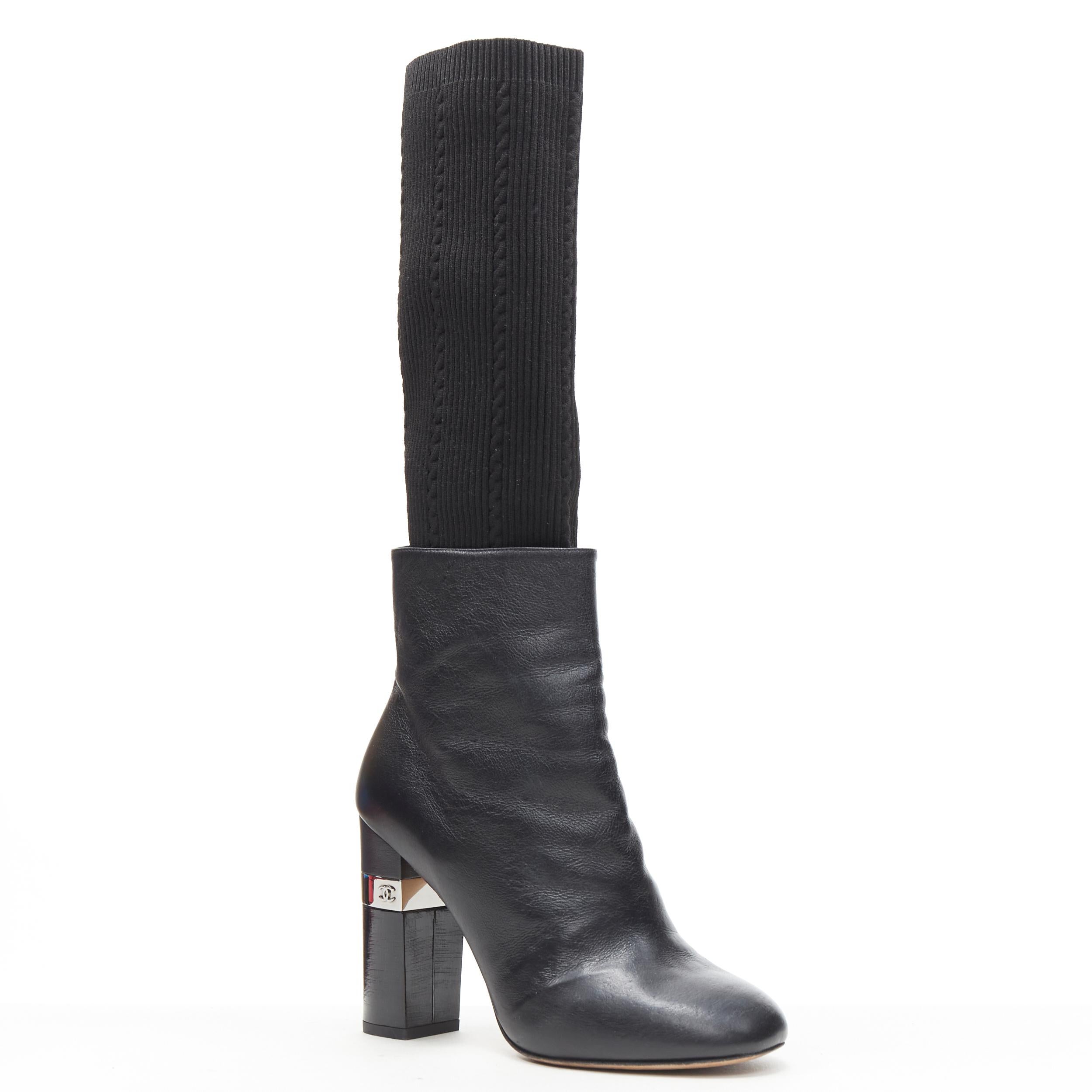 CHANEL black leather round toe CC metal chunky heel ribbed sock bootie EU37.5 
Reference: GIYG/A00114 
Brand: Chanel 
Designer: Karl Lagerfeld 
Material: Leather 
Color: Black 
Pattern: Solid 
Closure: Zip 
Extra Detail: Attached ribbed sock knit.