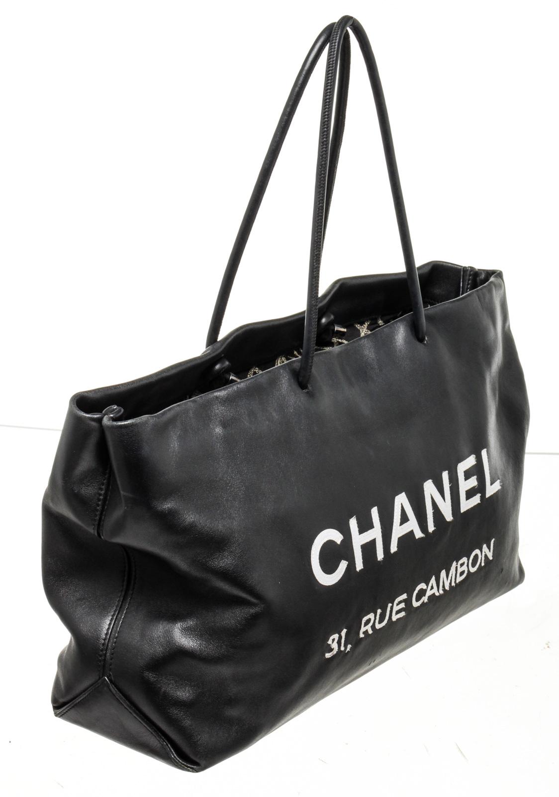 Chanel Black Leather Rue Cambon Tote Bag with leather, gold-toneÂ hardware, interior slip pockets, shoulder strapÂ and zipperÂ closure.

47194MSC