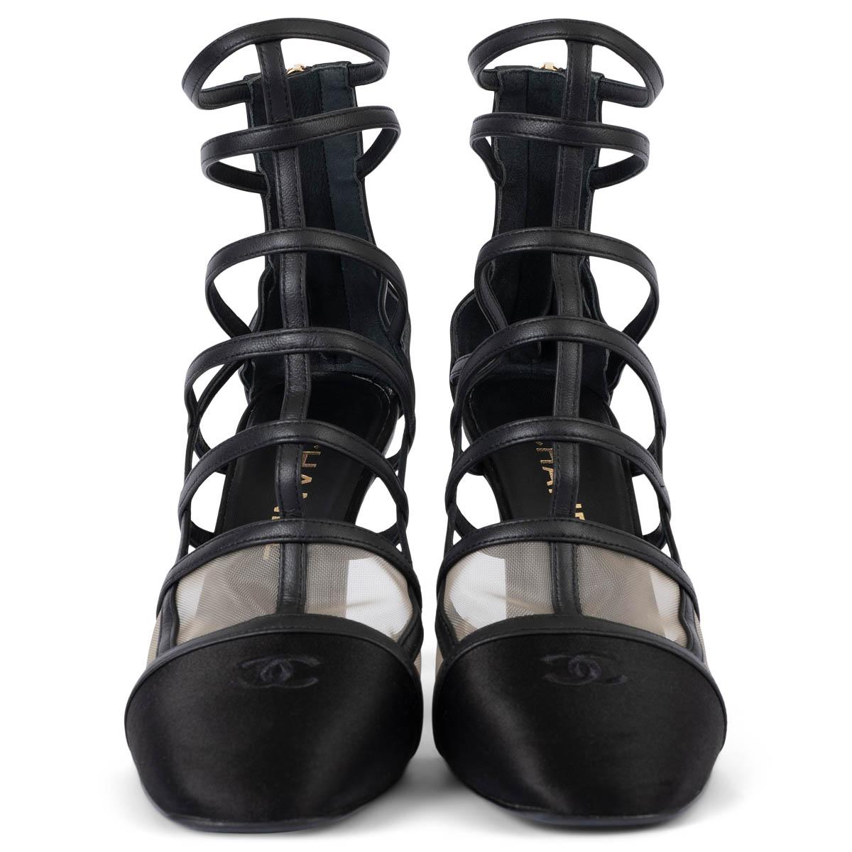 100% authentic Chanel caged cut-out ankle-boots in black leather featuring black CC satin cap toe and nude mesh inserts. Open with a zipper on the heel. Have been worn and are in excellent condition. 

Measurements
Imprinted Size	38
Shoe