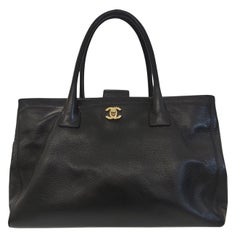 Vintage Chanel black leather shoulder handle bag
