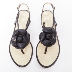 CHANEL black leather silver CC logo camellia flat T strap sandals EU37.5