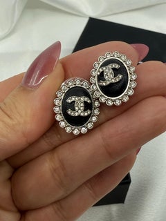 CHANEL Black Leather Silver Crystal CC Oval Earrings