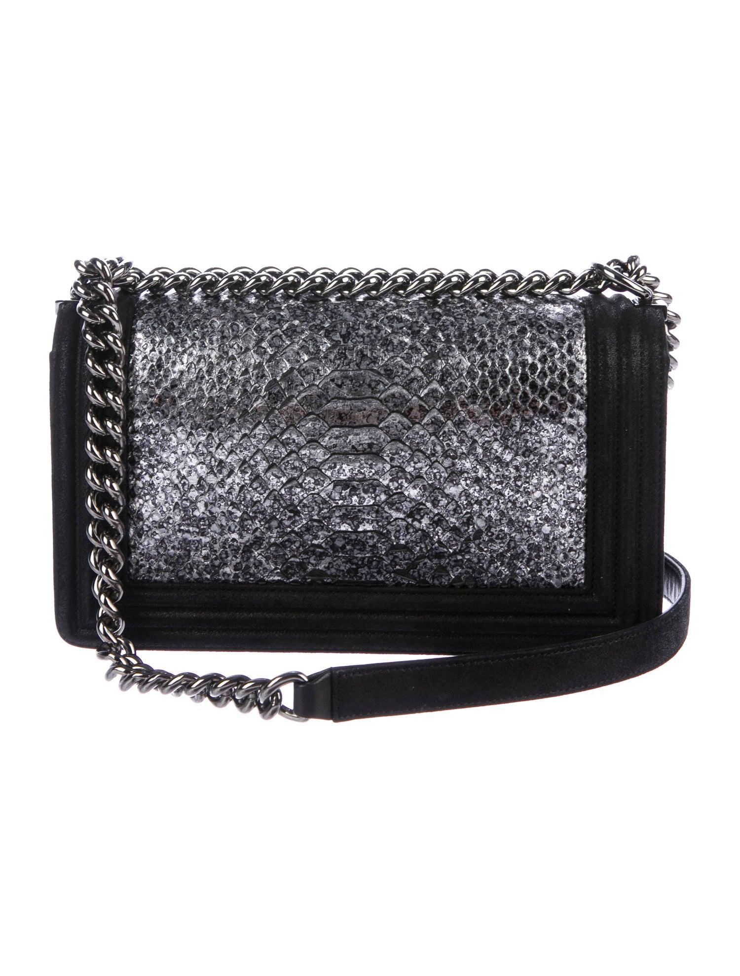 Chanel Black Leather Silver  Snakeskin Exotic Boy Small Shoulder Flap Bag

Snakeskin
Leather
Silver-tone hardware
Suede lining
Push-lock closure 
Date code present 
Made in France
Shoulder strap drop 20