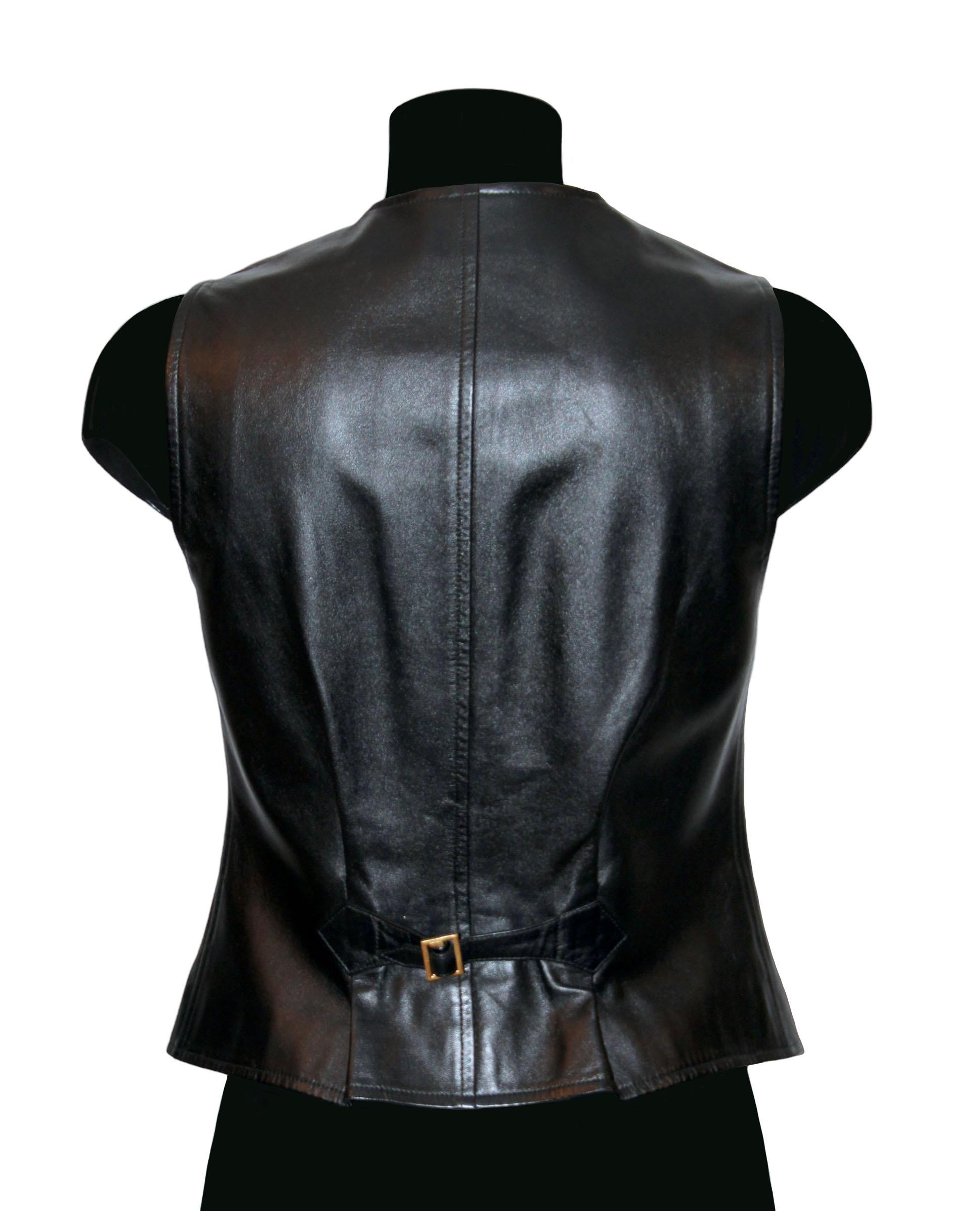 This pre-owned lambskin leather vest is a master piece from the house of Chanel !
It features a V-neckline, 6x gold-tone CC buttons and 4x flat pockets.
A back belt tightening strap allows a more fitted waist line.

Collection: Fall 1993
Material: