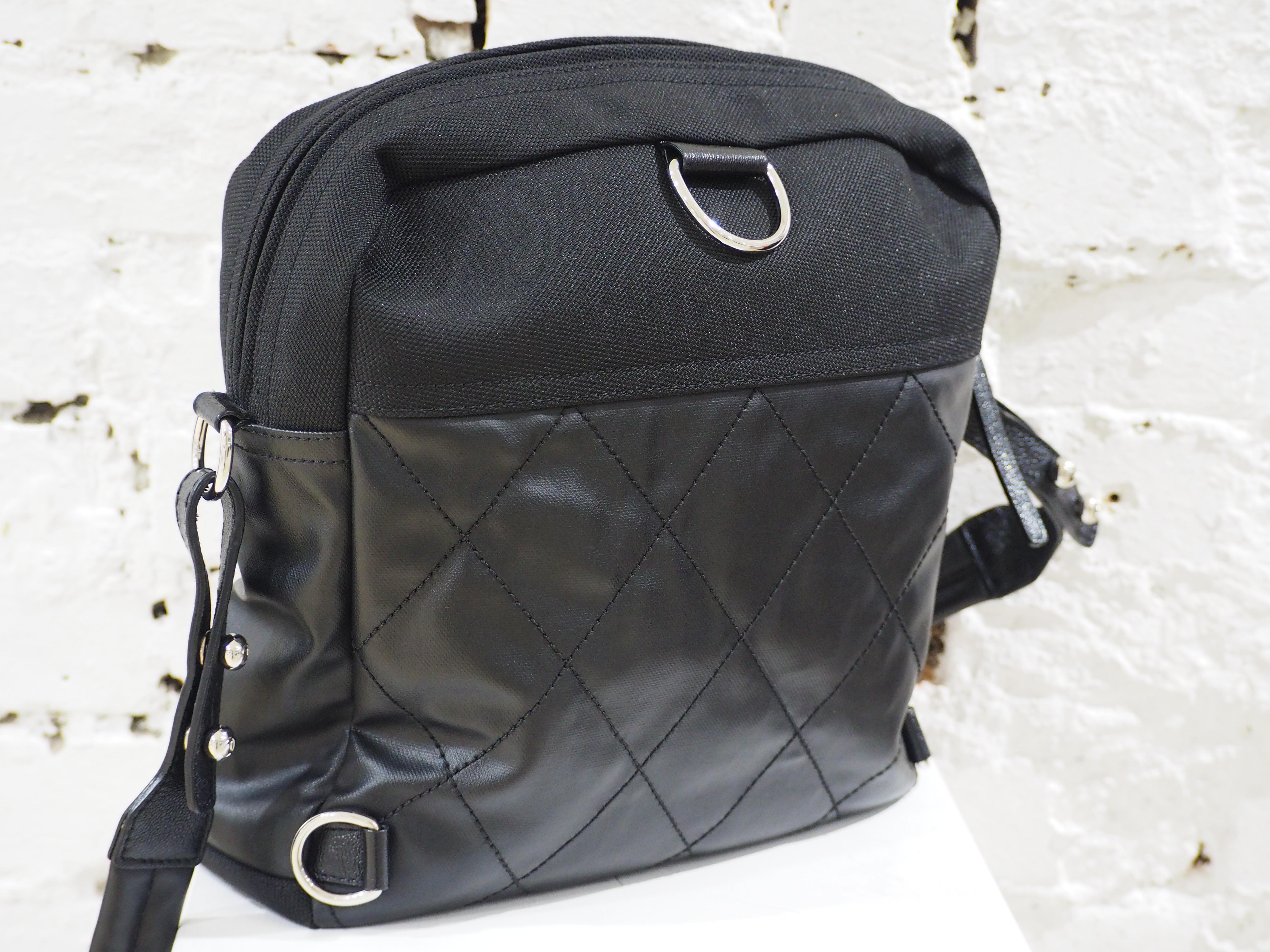 Chanel black leather textile shoulder bag / backpack
silver tone hardware
CC logo 