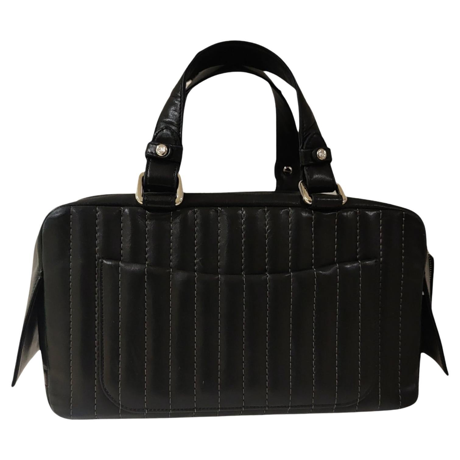 Chanel black leather vertical shoulder handle bag