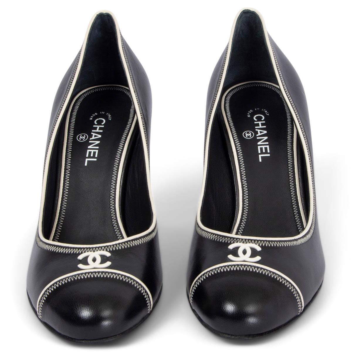 100% authentic Chanel round-toe pumps in black smooth calfskin with white contrast stitching and piping. CC logo embellishment on tip. Brand new. 

Measurements
Imprinted Size	36C
Shoe Size	36
Inside Sole	22.5cm (8.8in)
Width	6.5cm (2.5in)
Heel	8cm
