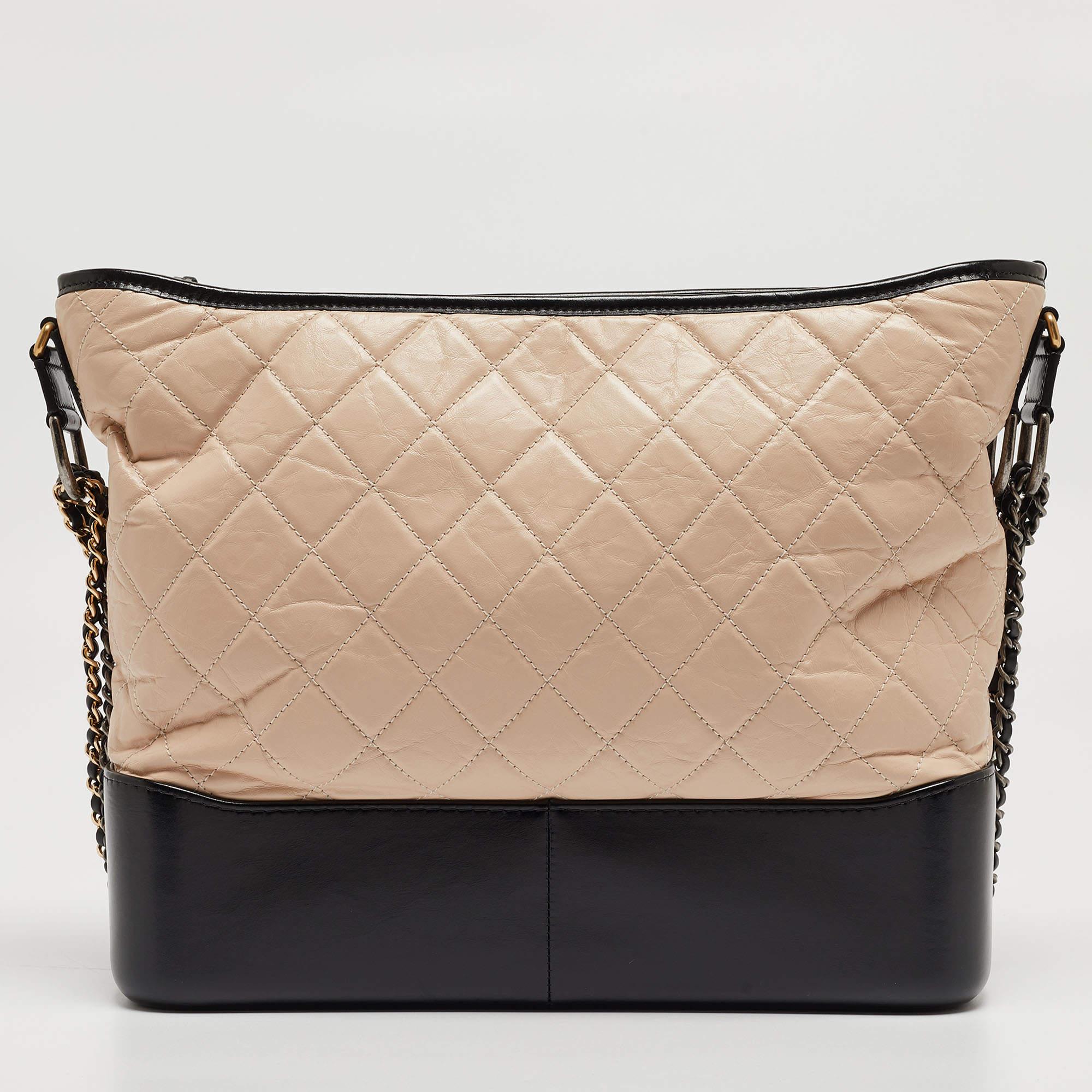 Embrace timeless allure with the Chanel Gabrielle hobo. Crafted with meticulous attention to detail, this hobo bag boasts a classic quilted leather design in contrasting hues, exuding effortless chic. Its spacious interior and adjustable strap offer