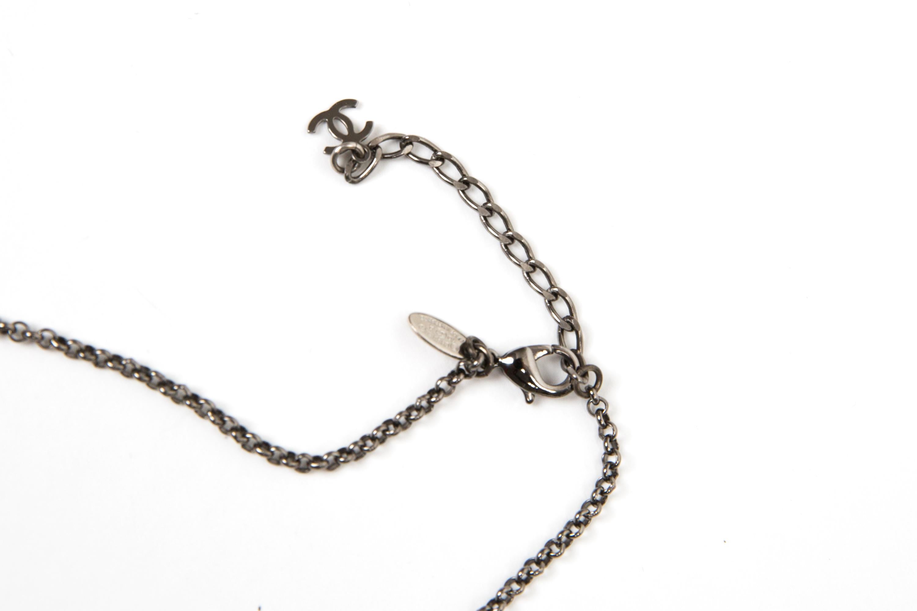 Chanel Black Logo and Bones Necklace In Good Condition For Sale In Paris, FR