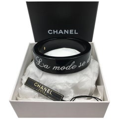 Chanel Black Logo Bangle - La Mode se Demode. Le Style Jamais Coco Chanel