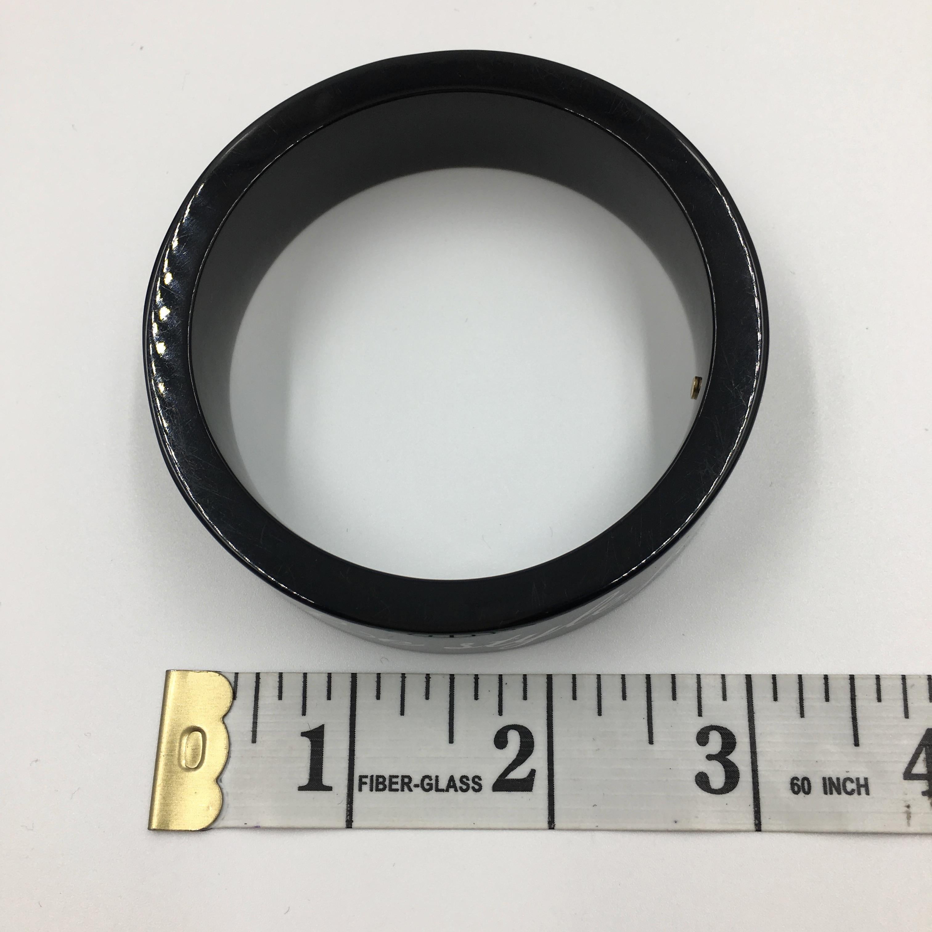 Women's or Men's Chanel Black Logo Bangle - La Mode se Demode. Le Style Jamais Coco Chanel For Sale