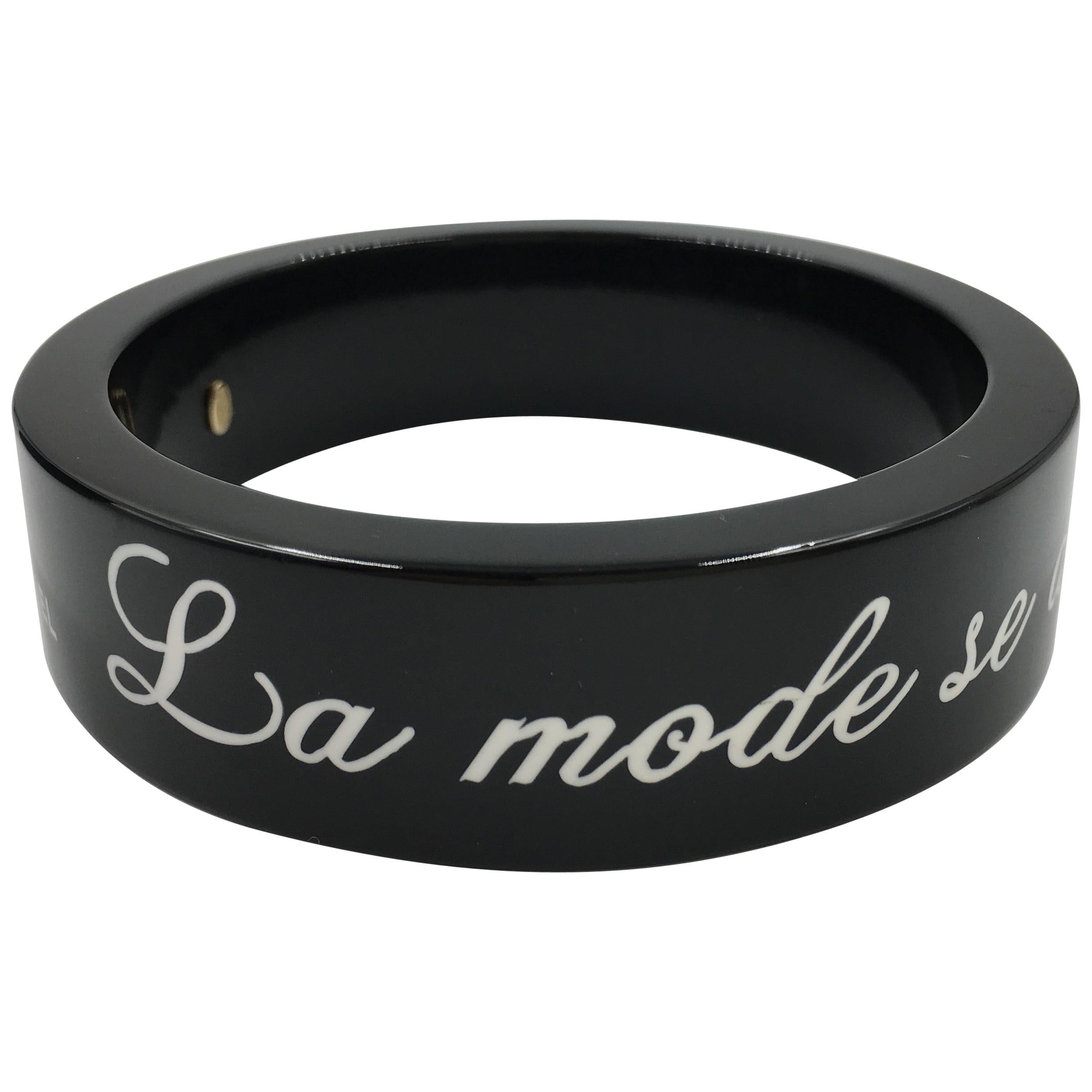 Chanel Black Logo Bangle - La Mode se Demode. Le Style Jamais Coco Chanel For Sale