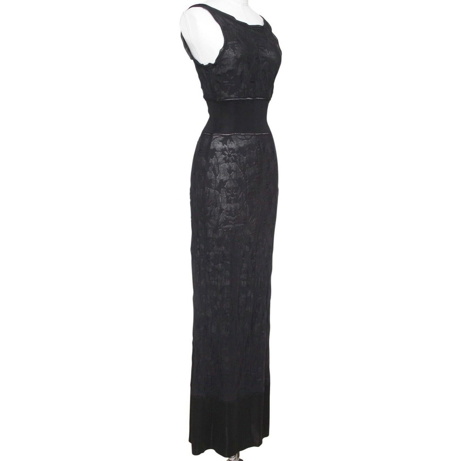 GUARANTEED AUTHENTIC CHANEL SPRING 2011 COLLECTION LONG SHEER BLACK KNIT SLEEVELESS DRESS

Retail excluding taxes $2.995

Details:
- Black sheer floral black knit long dress.
- Scoop neck.
- Elasticized at waist, partial side zipper