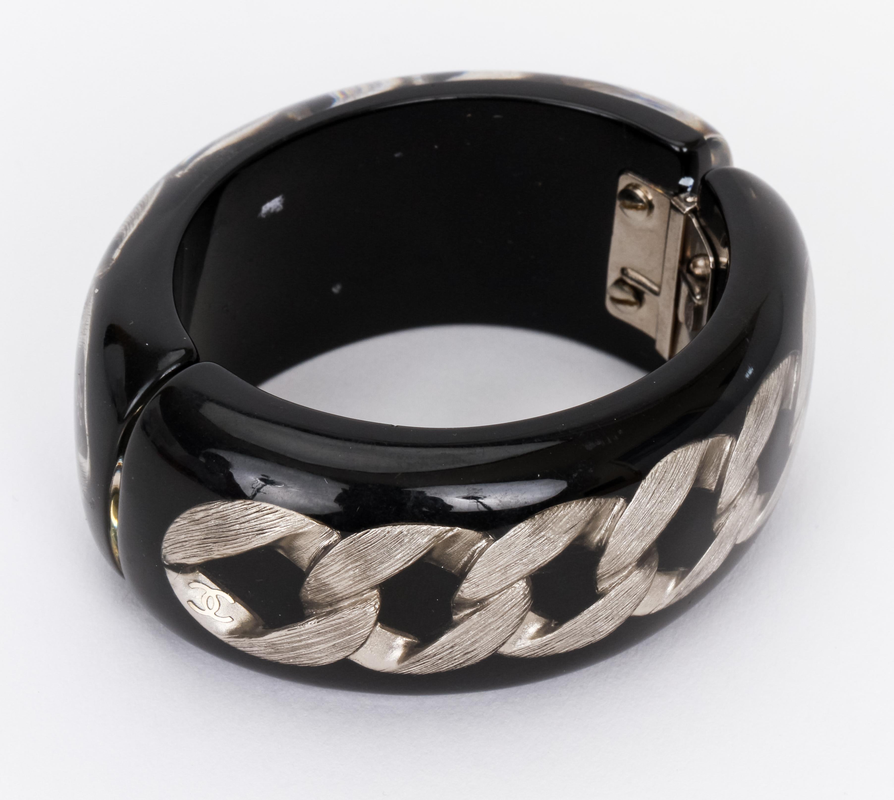 Chanel black lucite hinged oval cuff with ruthenium chain inlay, circumference 9.5”, original pouch