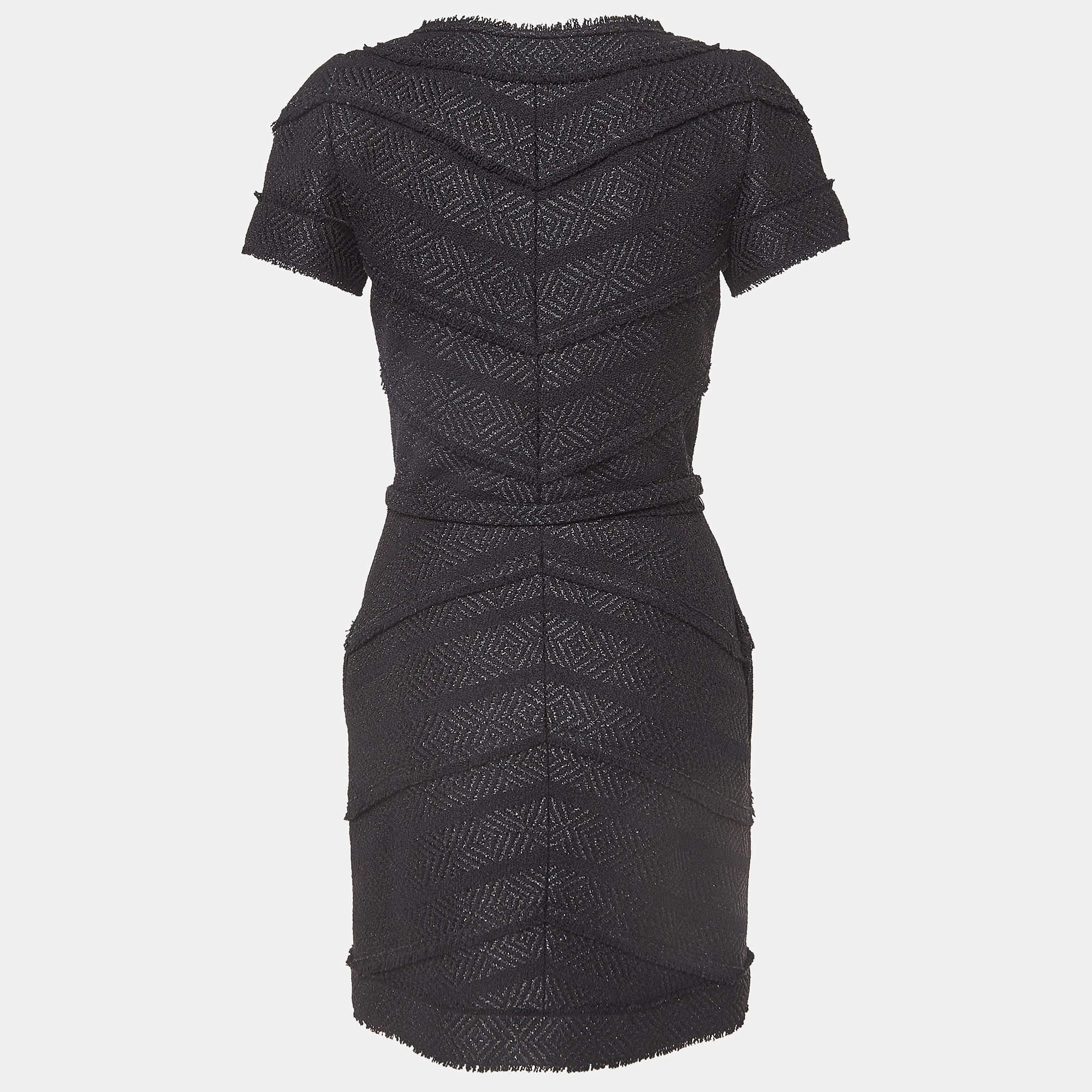 This Chanel tweed dress is a chic and stylish garment that exudes elegance and sophistication. With its sleek design, flattering silhouette, and high-quality craftsmanship, this dress is perfect for any special occasion or evening event, ensuring