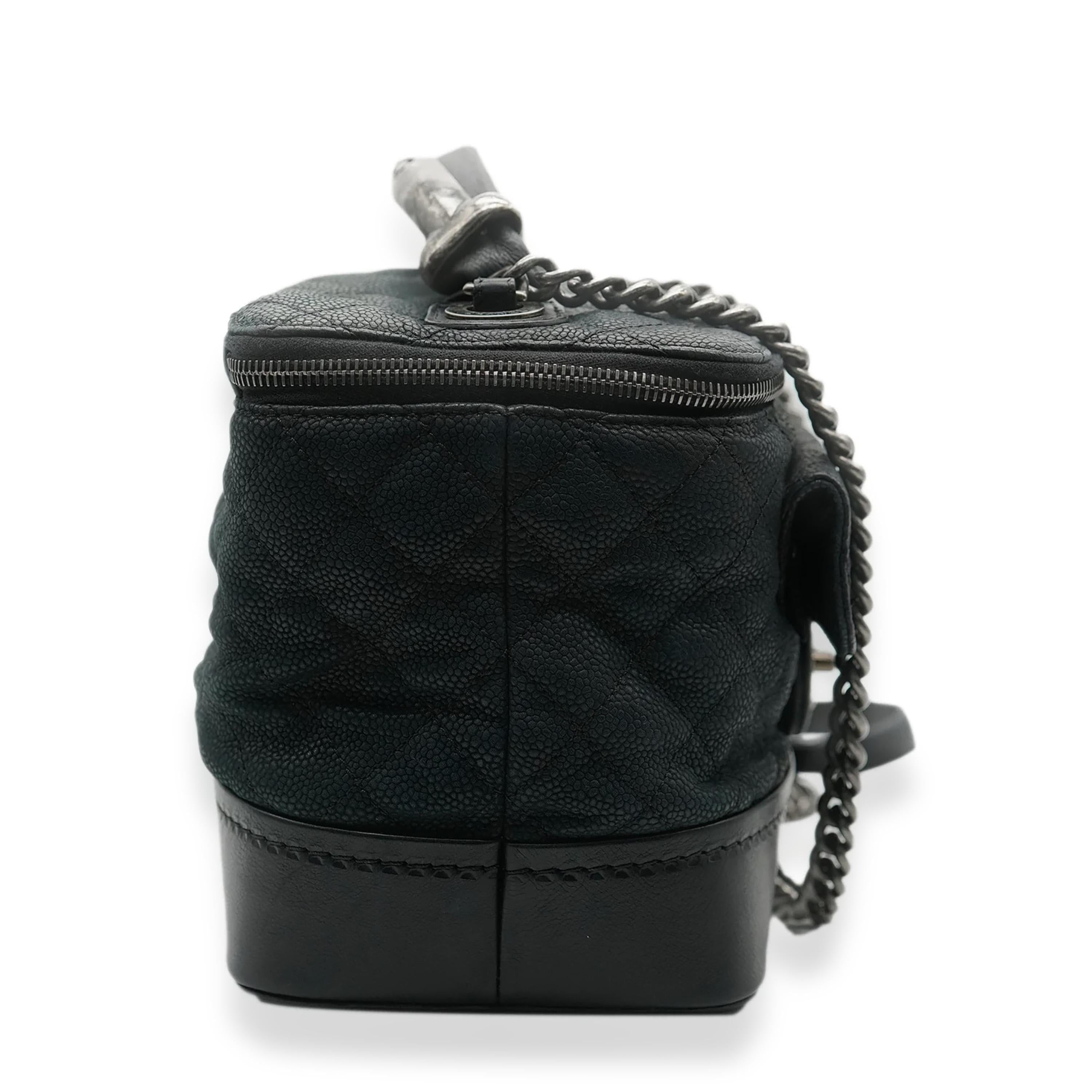 Listing Title: Chanel Black Matte Caviar Globe Trotter Vanity Case
SKU: 138025
Condition: Pre-owned 
Handbag Condition: Fair
Condition Comments: Item is in fair condition with prominent signs of wear. Shape has relaxed significantly. Scuffing to