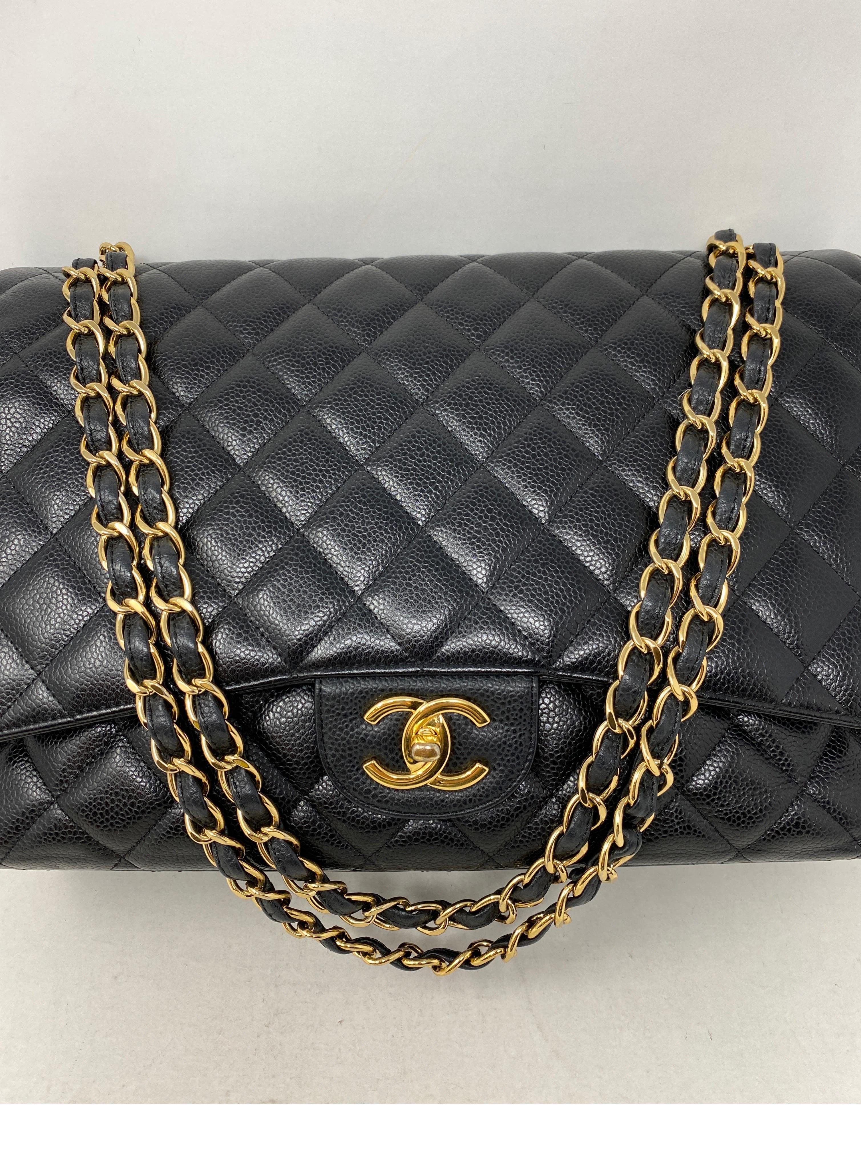 Chanel Black Maxi Double Flap Bag. Caviar leather with gold hardware. Good condition. Light wear on turn lock. Loss of gold plating. Overall good condition. Pricing of Chanel has gone up. Investment bag. Includes authenticity card. Guaranteed