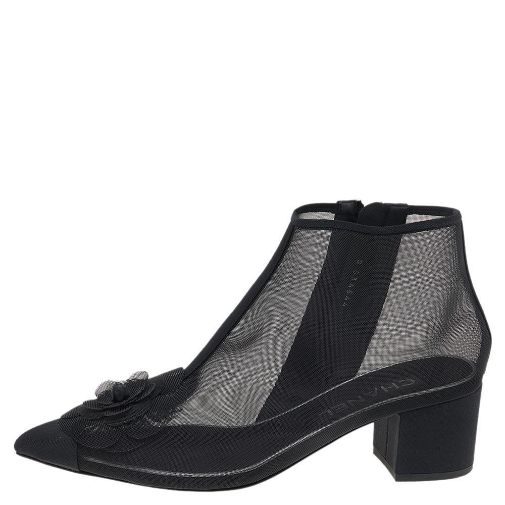 Your dream of owning a pair of Chanel boots can come true with these ones that are hard to miss! They are crafted from black mesh in a pointed toe silhouette and designed with the Camellia applique on the vamps. They are complete with logo-detailed