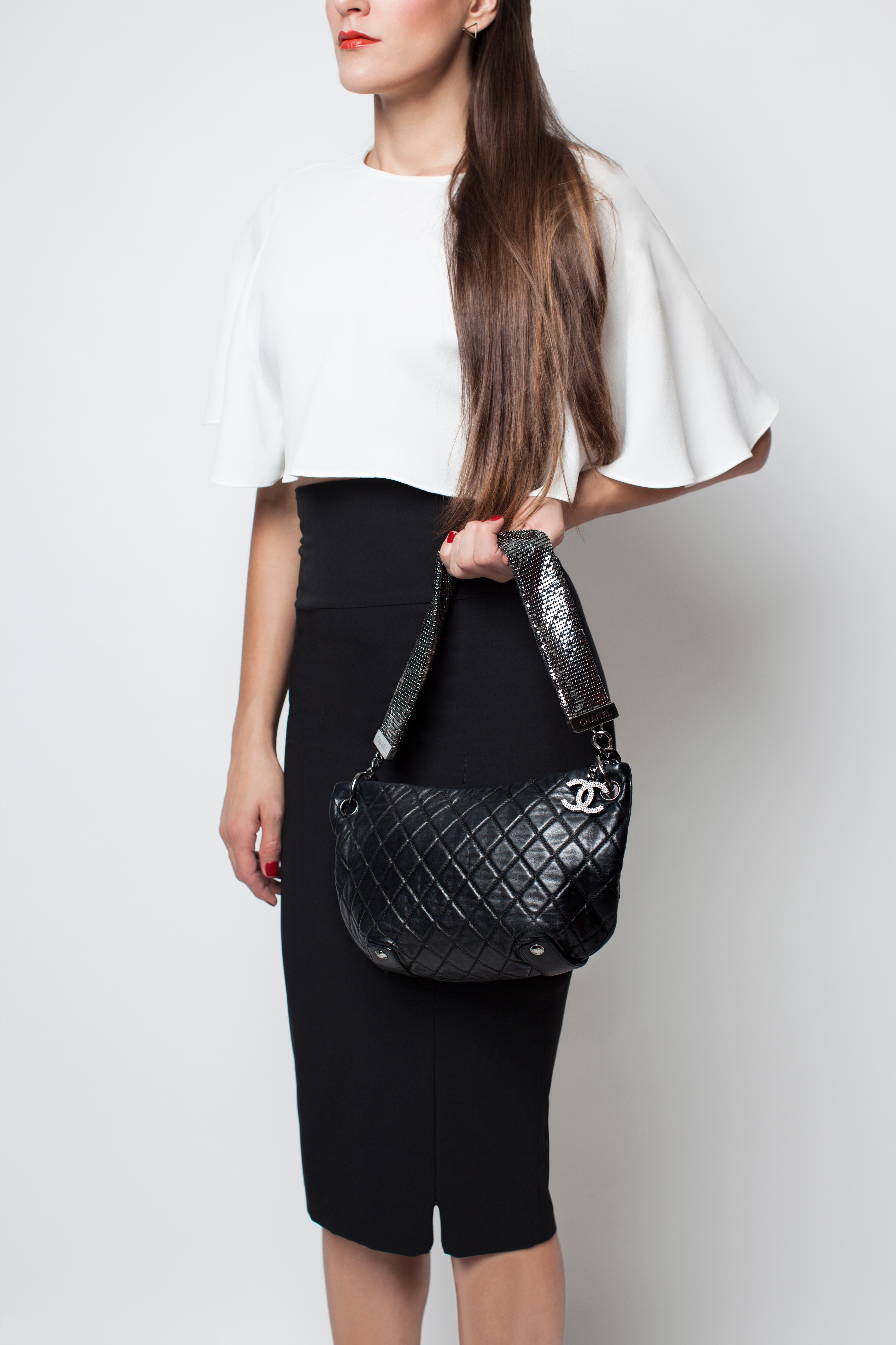 Chanel black mesh chain soft lambskin quilted small tote 

Year: 2008

Antique silver hardware
Mesh chain strap with Chanel engraved on base
Mesh print large CC zipper pull
Grey satin microfiber interior
Interior zippered center pocket
Bottom CC