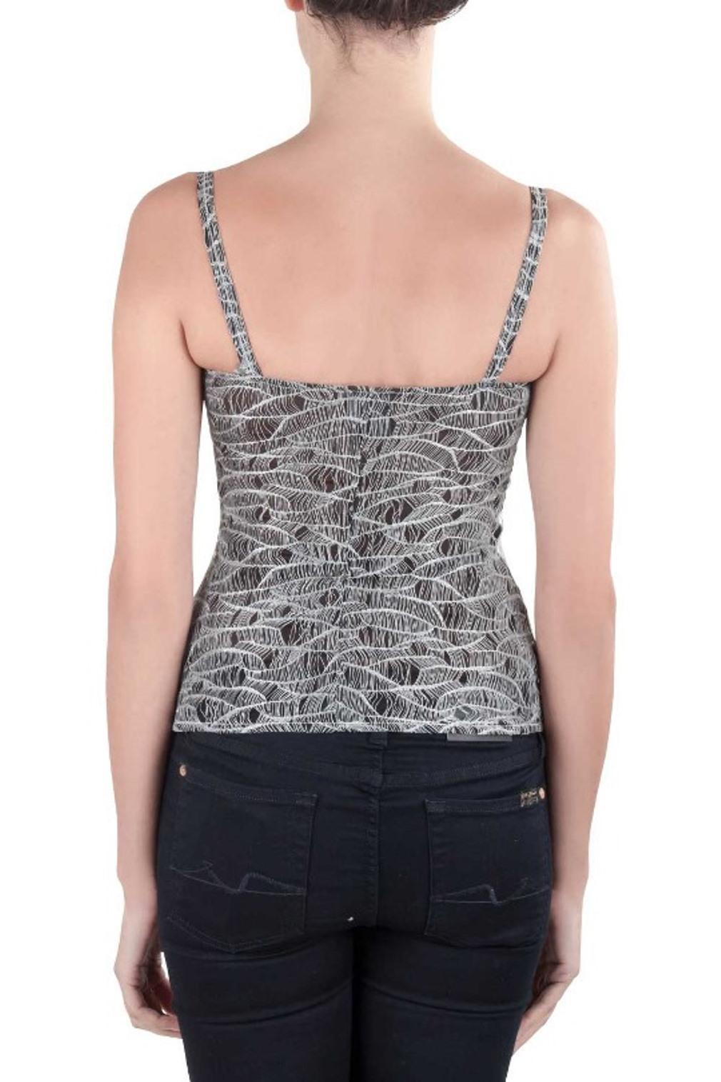 Made by Chanel, this camisole is tailored from nylon. The black metallic creation has beautiful embellishments on the neckline. This is an ideal purchase to stay cool yet fashionable these summers. It will go well with any dark bottoms.

Includes: