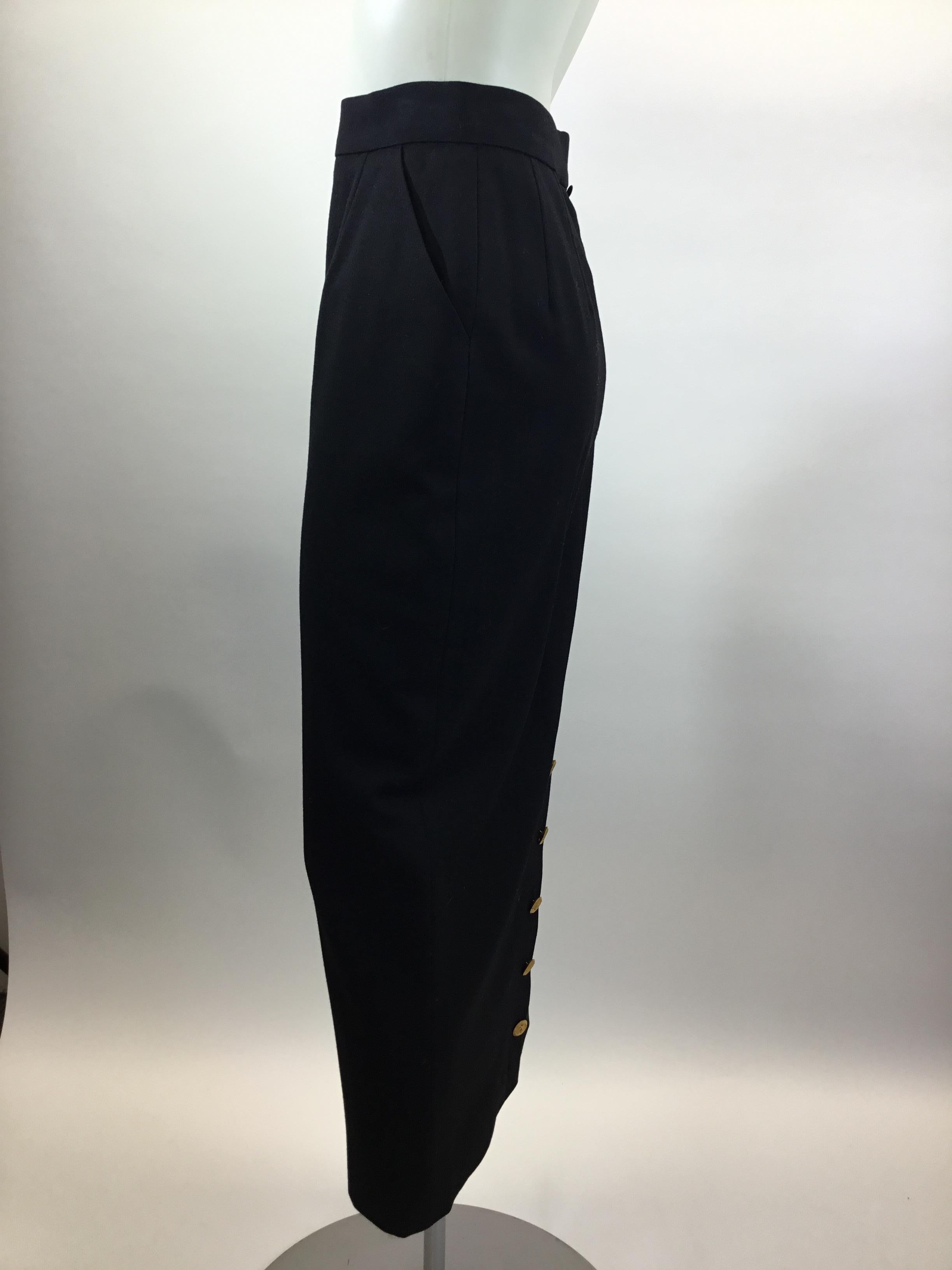 Chanel Black Mid-Length Skirt with Gold Buttons
$199
Made in France
Length 34”
Waist 24”
Hip 33”