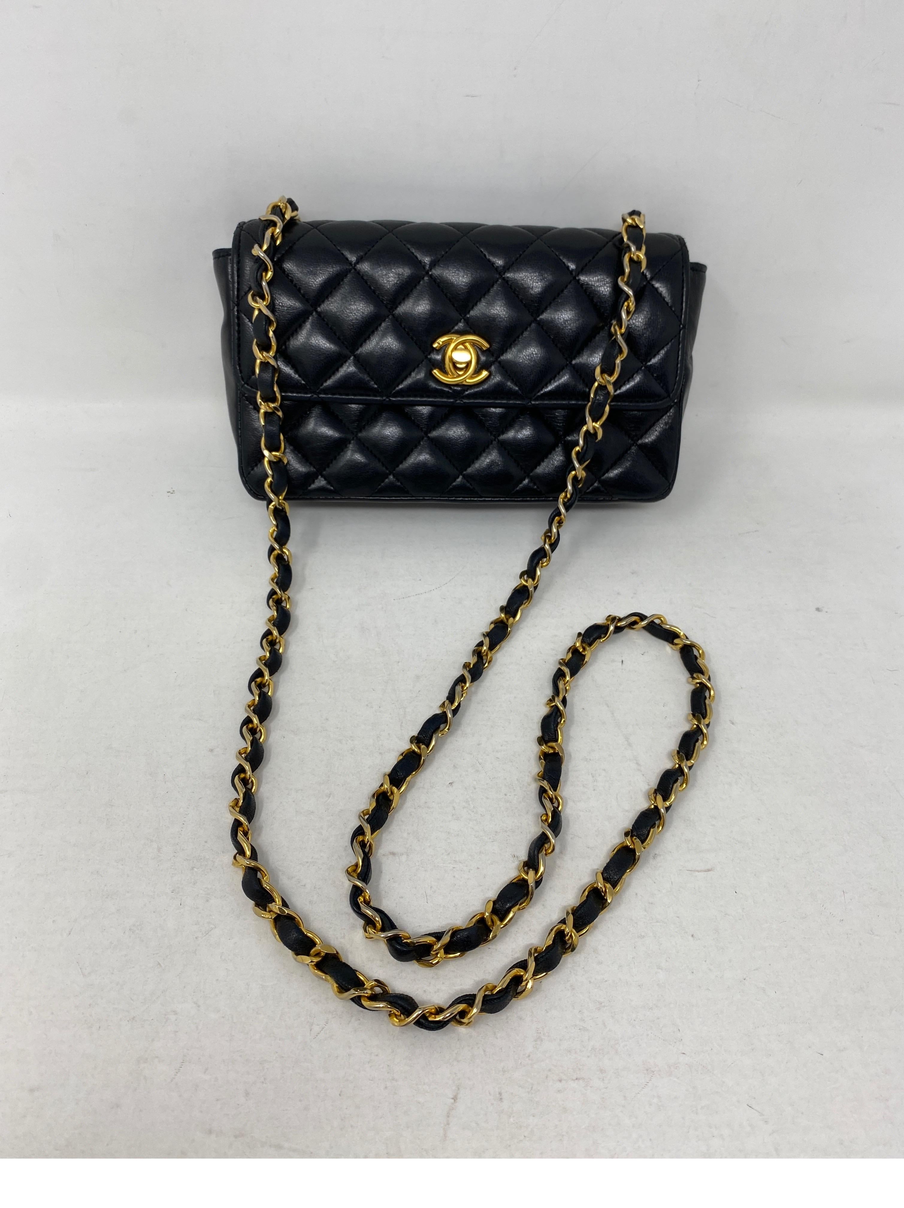 Chanel Mini Black Rectangular Bag. Lambskin black leather with gold hardware. The most sought over size bag for Chanel lovers. Vintage Chanel with gold hardware. Cell phone can fit. Strap can be doubled to wear shorter. 24 kt gold plated closure and